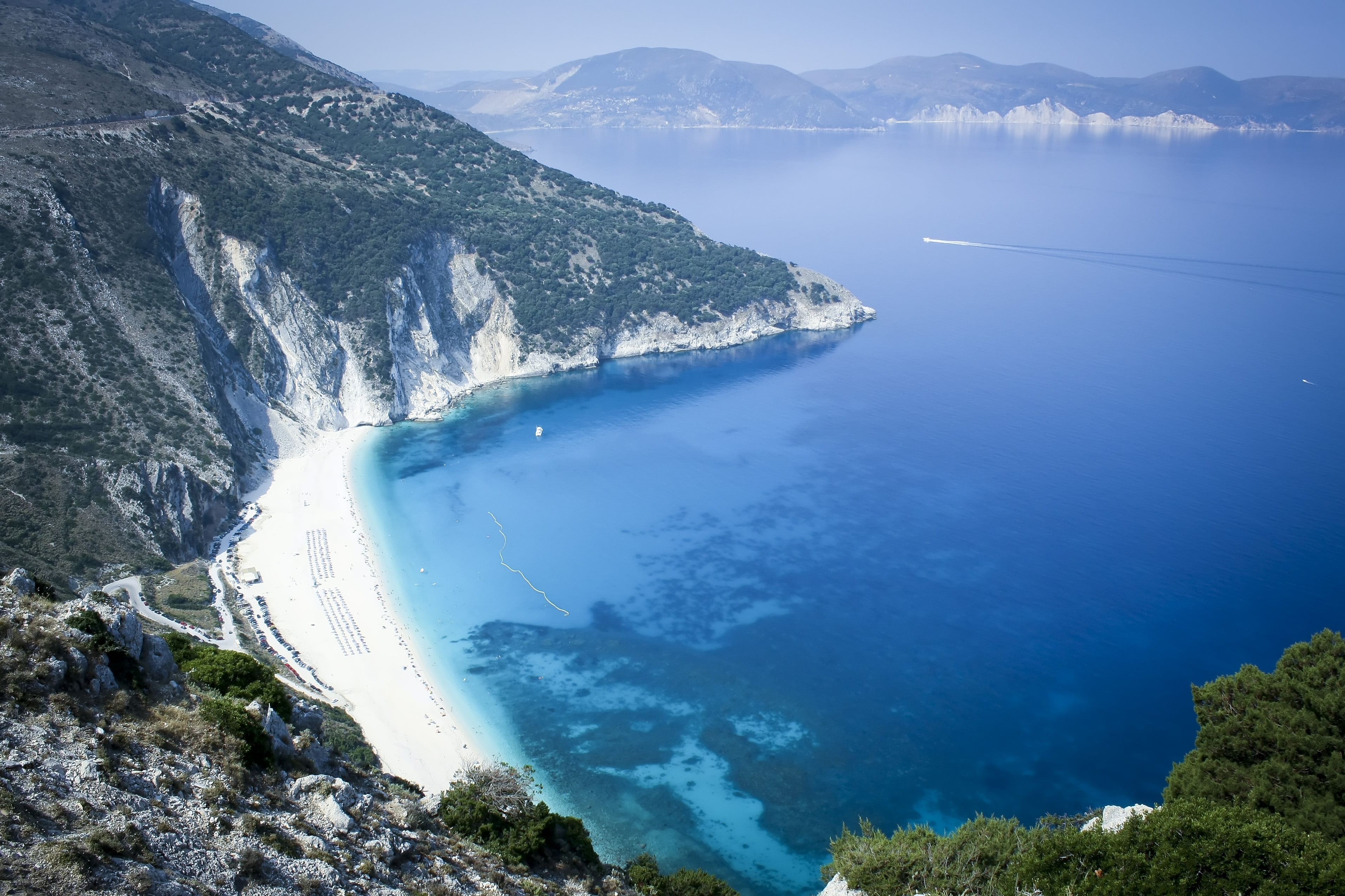 green and white mountain beside the ocean Myrtos Greek Greece 2k 4k