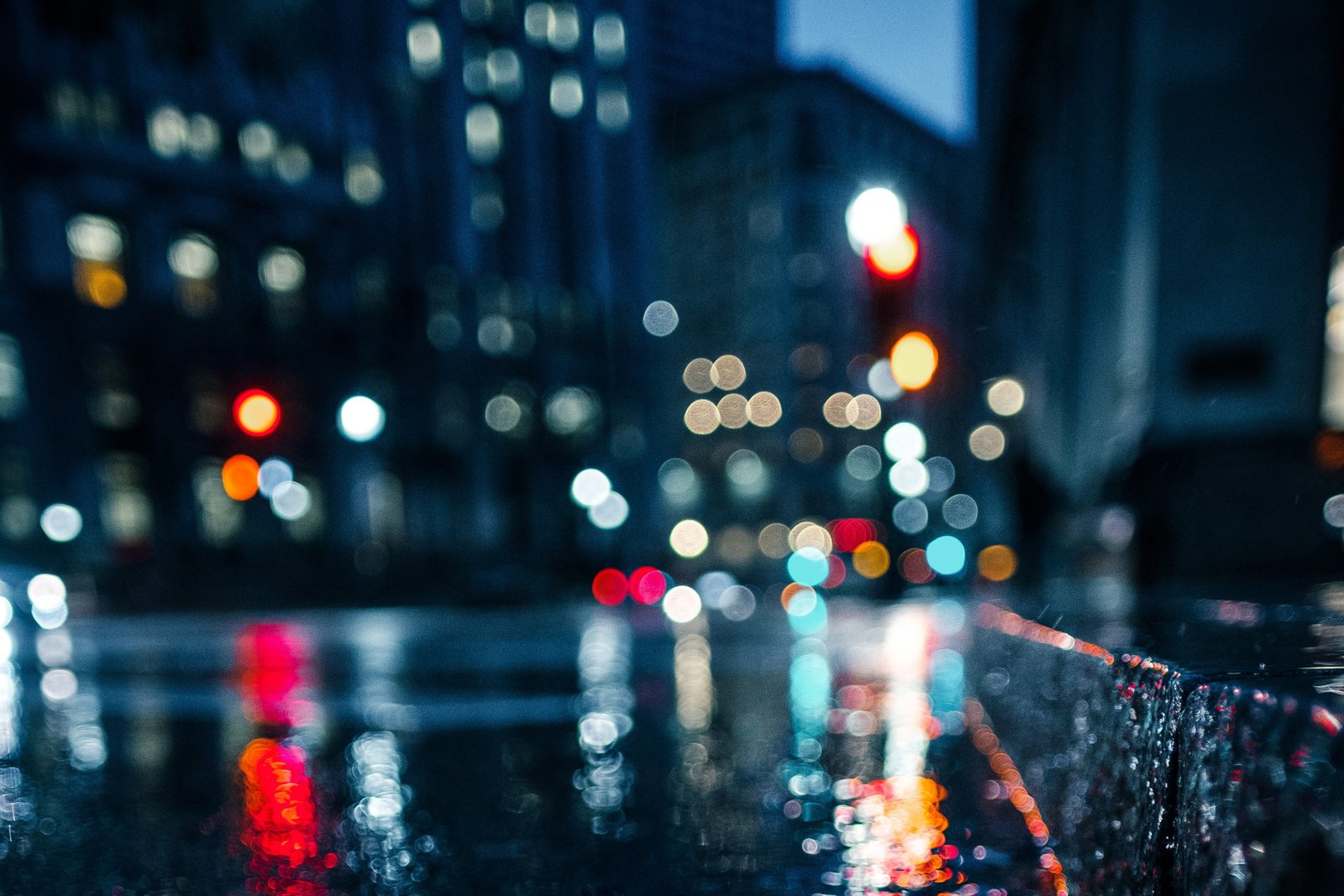 A wet city street at night urban abstract defocused cityscape 2k 4k