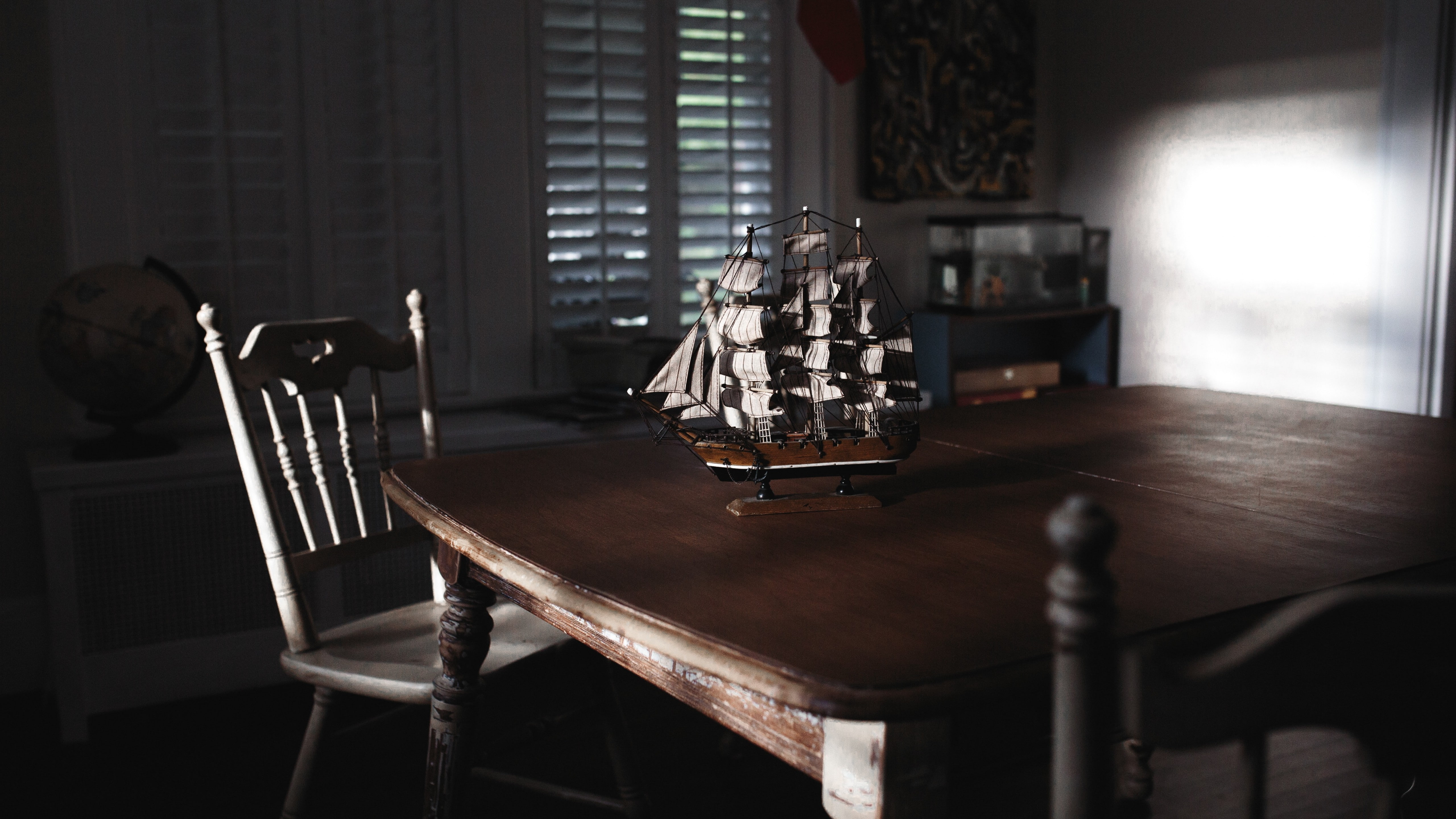 galleon ship scale model on brown wooden table inside room abstract 2k 4k 5k