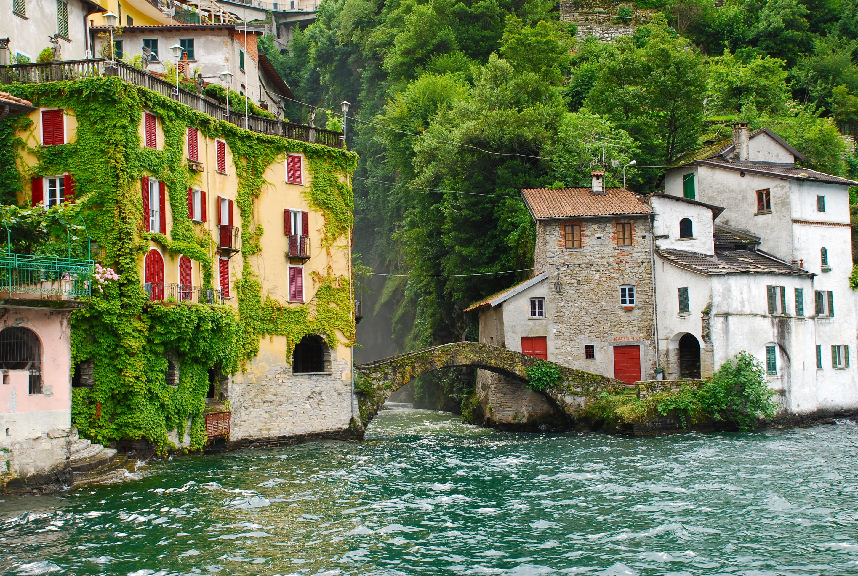 gray concrete house near body of water and trees at daytime Lake Como 2k
