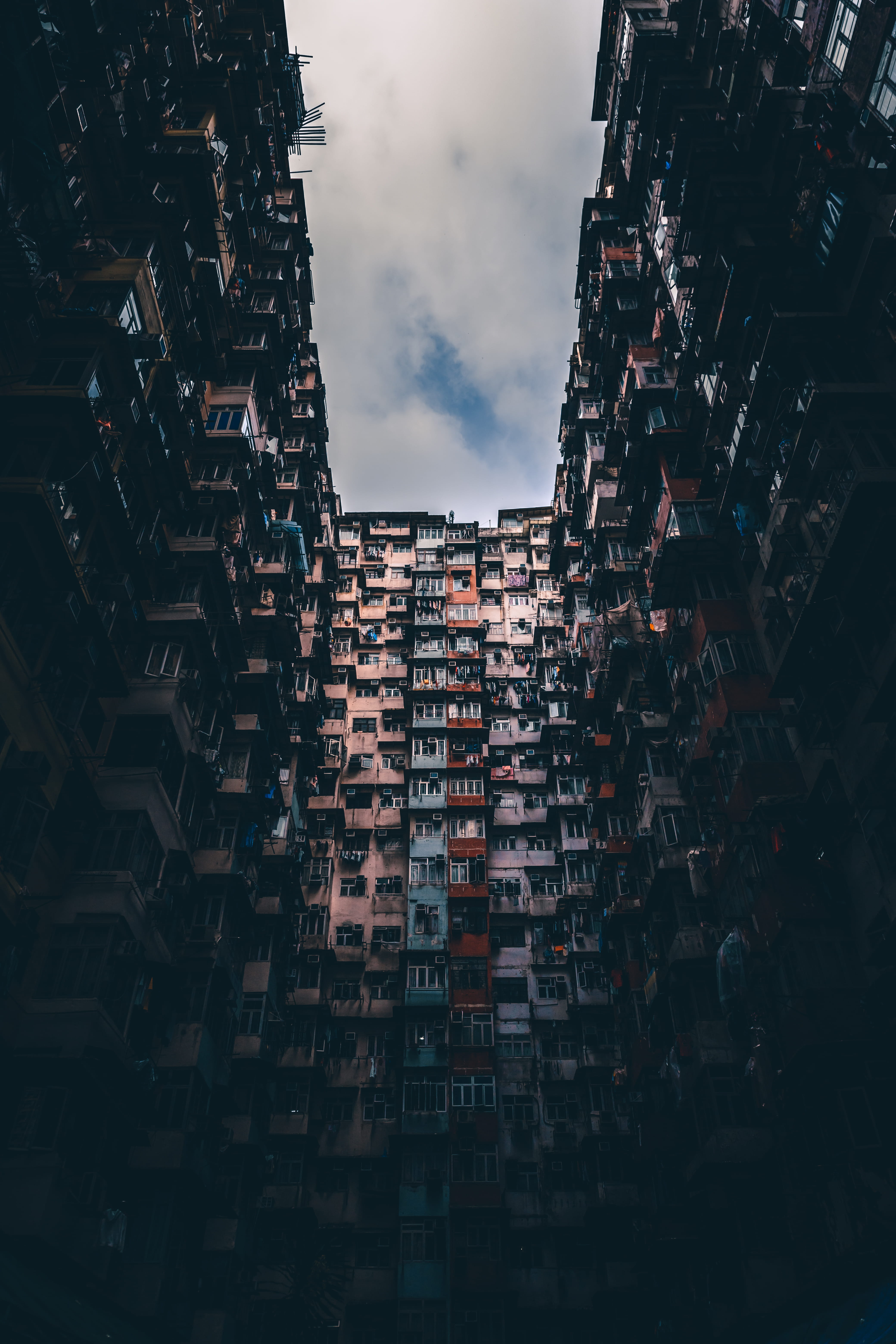 low angle photography of multicolored concrete building during daytime 2k 4k