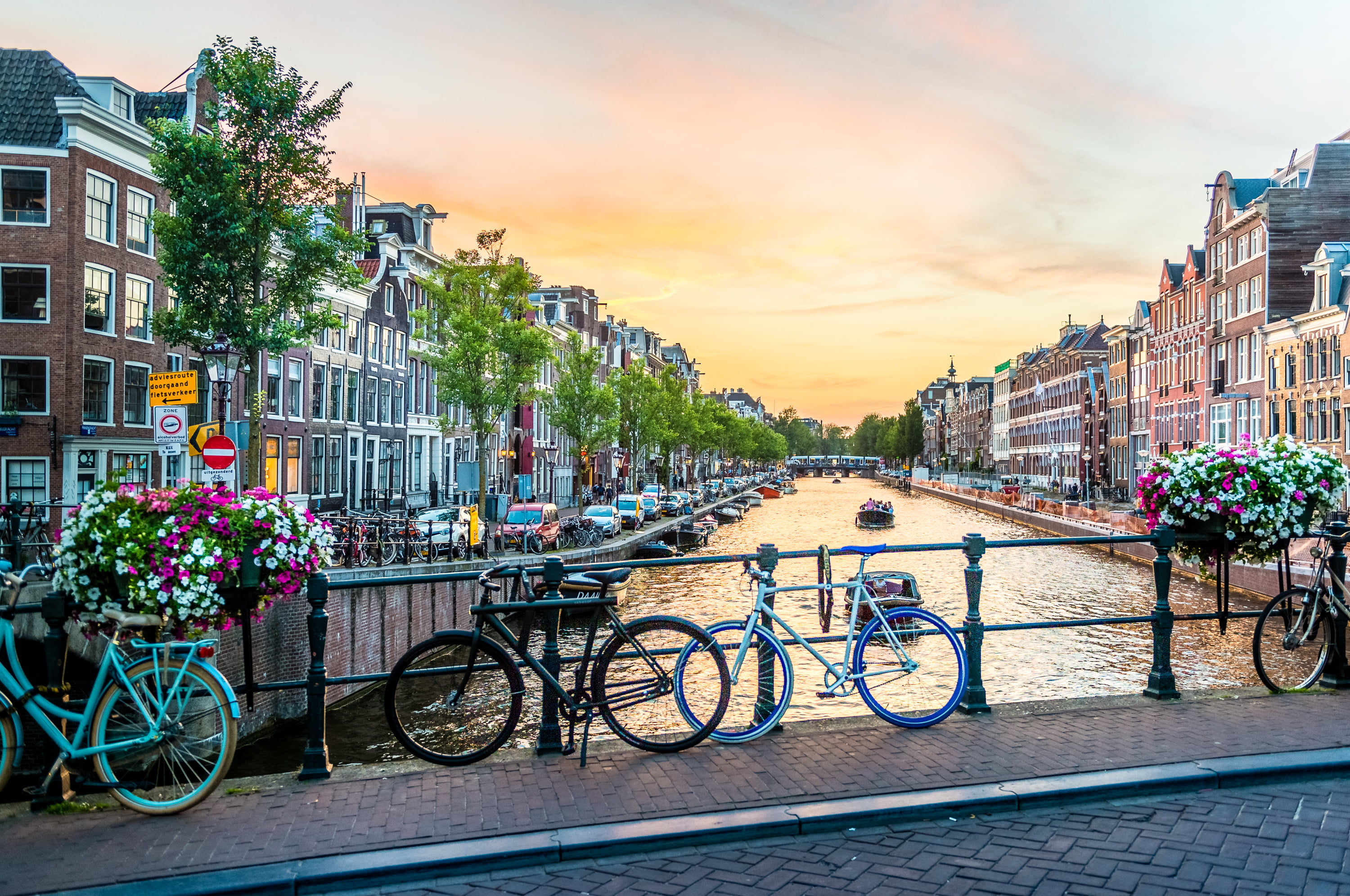 photography of bicycles parked on bridge amsterdam 2k