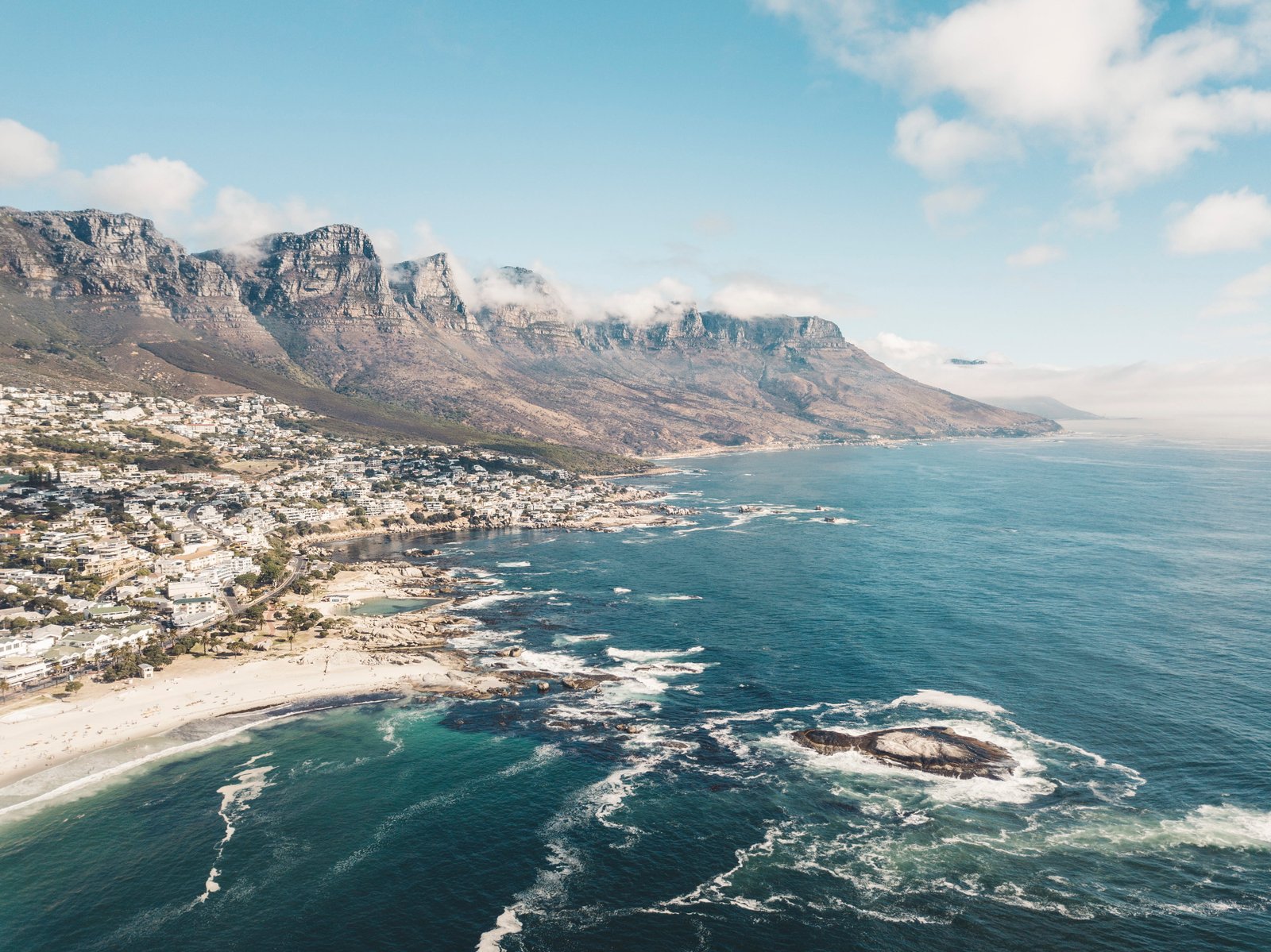 aerial view photography of seashore island and body water 2k 4k
