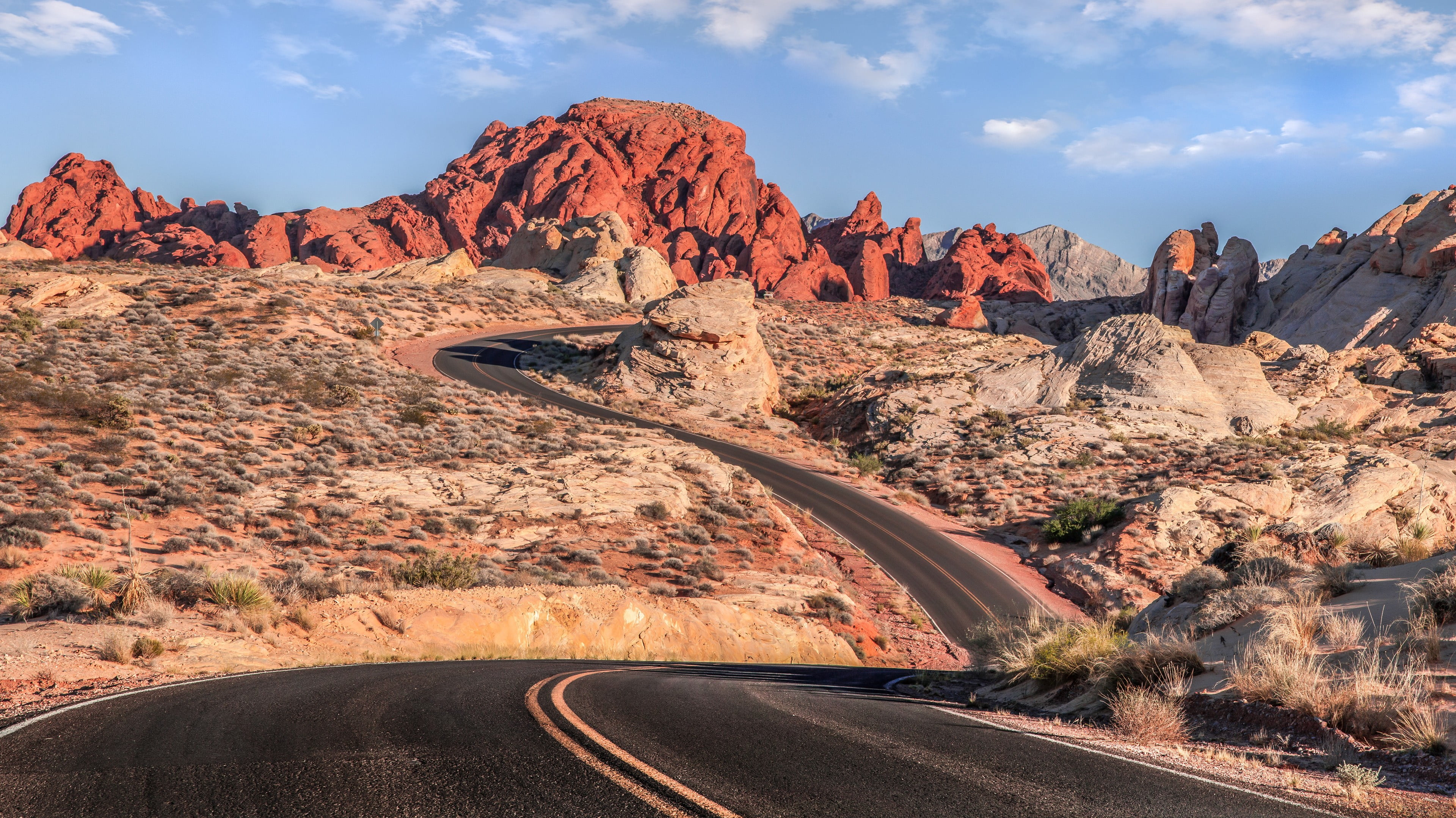 black asphalt road mountains desert clouds warm colors landscape 2k 4k