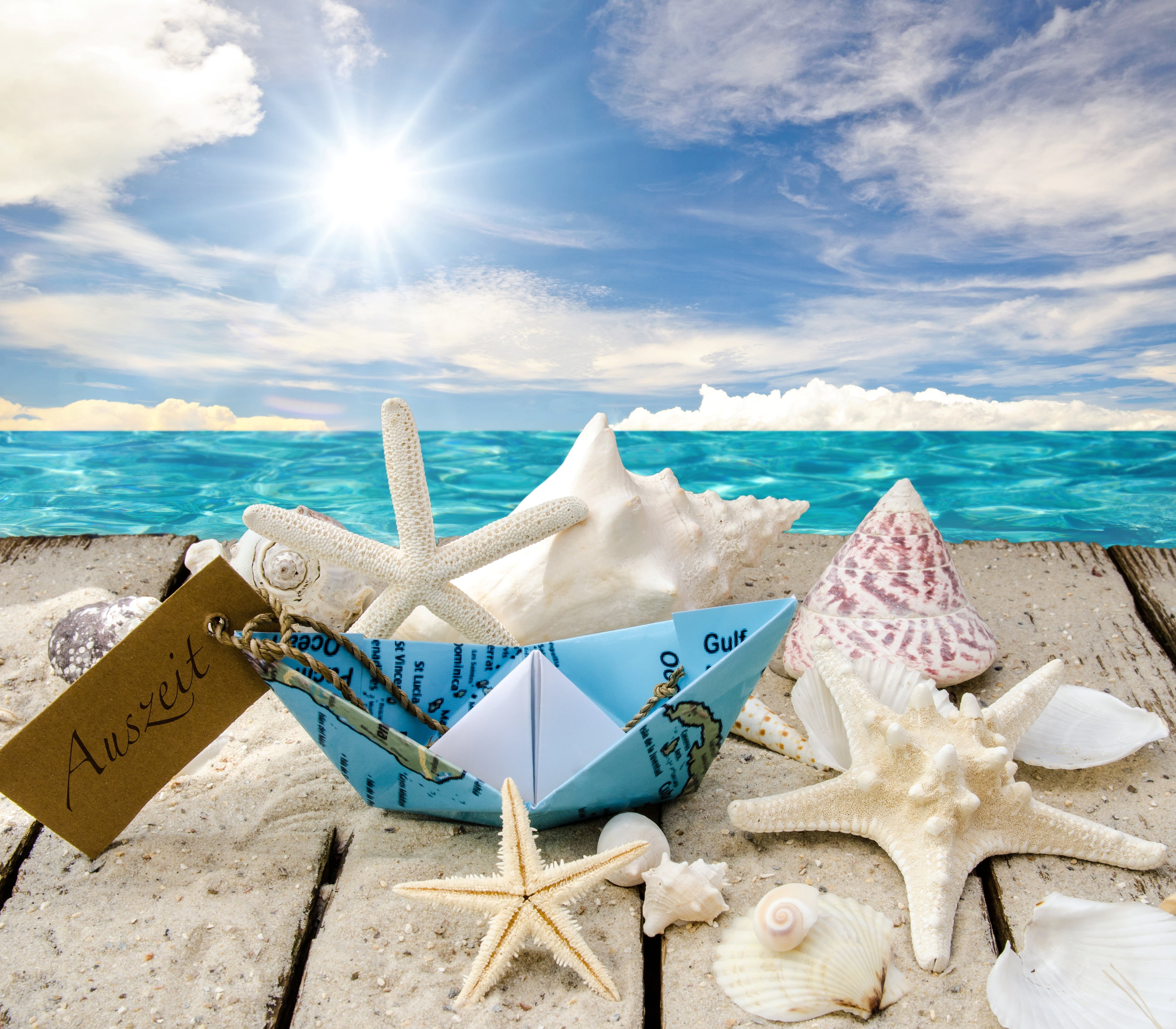 blue and white paper boat seashell lot beach the sun 2k 4k