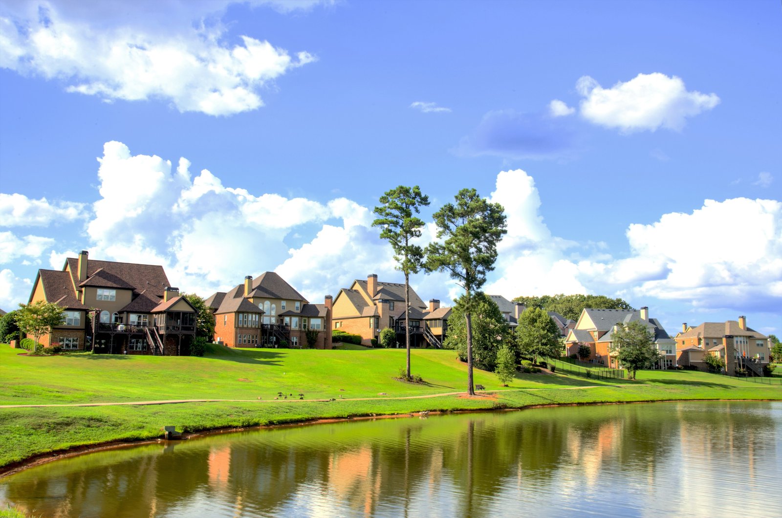 brown concrete house village near lake during daytime houses 2k 4k 5k