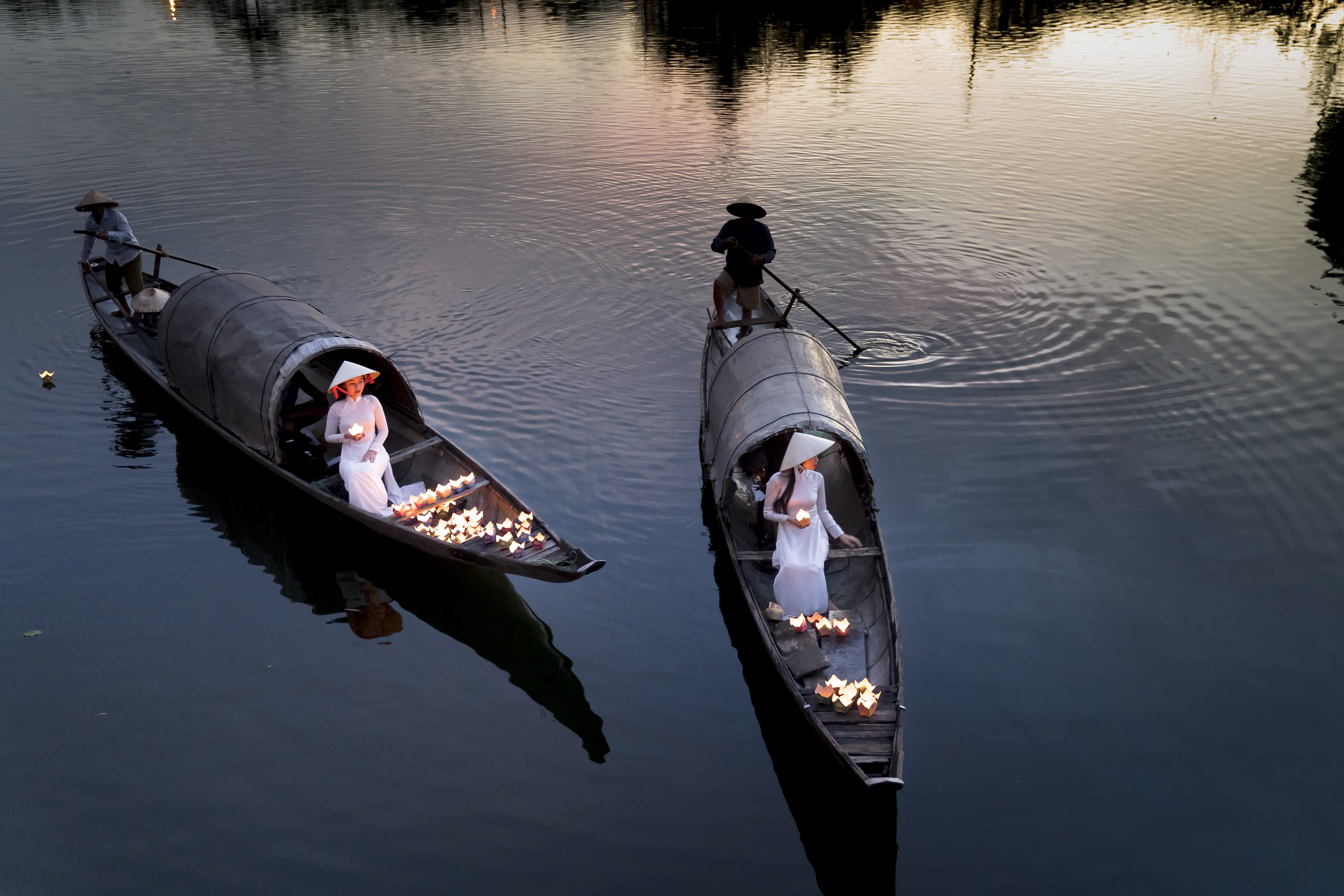 Four Person Using Two Boats on Calm Sea action ao dai boatman 2k 4k 5k 8k