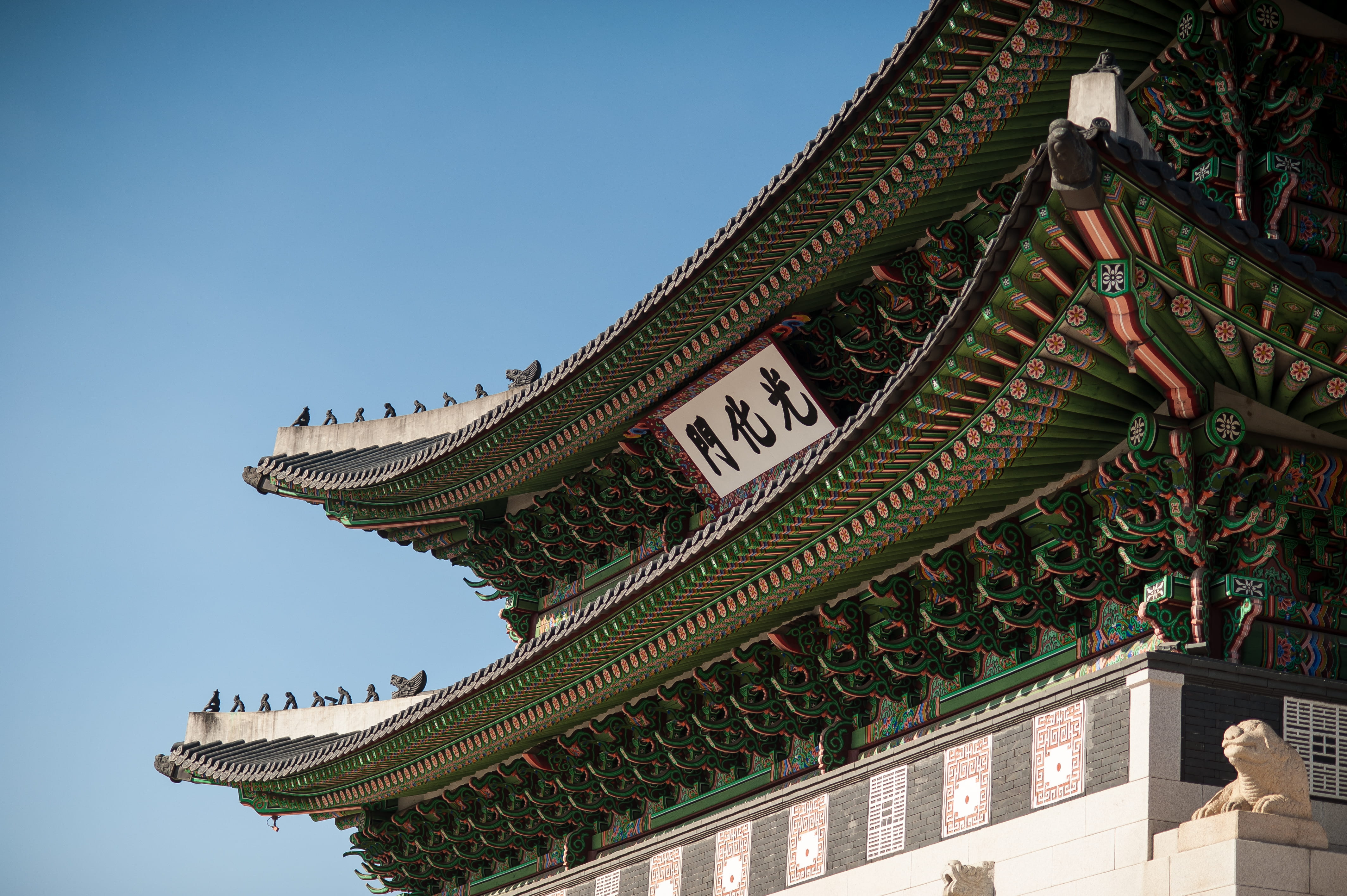 green and white temple at daytime pagoda building under blue sky 2k 4k