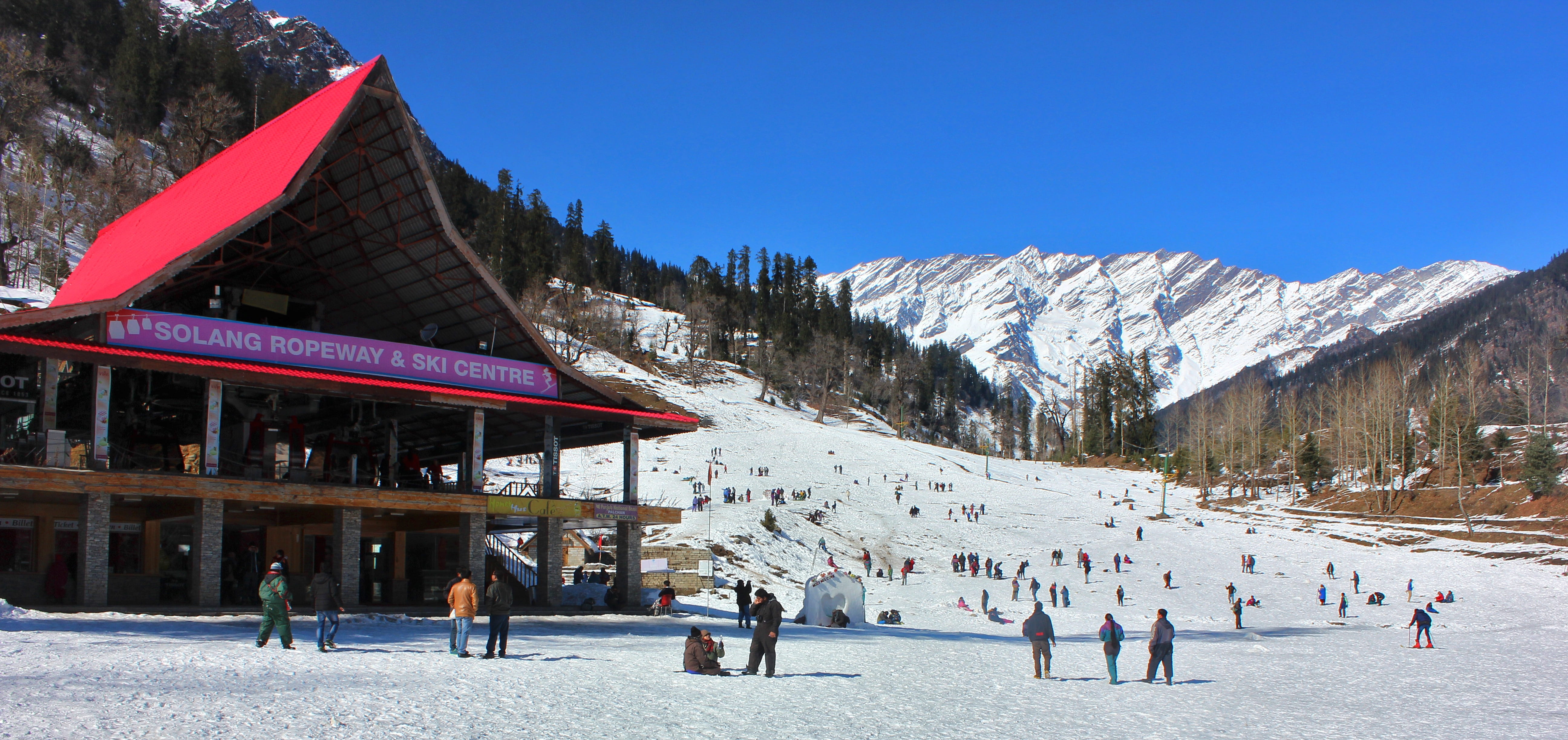 group of people near Solang Ropeway Ski Center during daytime 2k 4k 5k