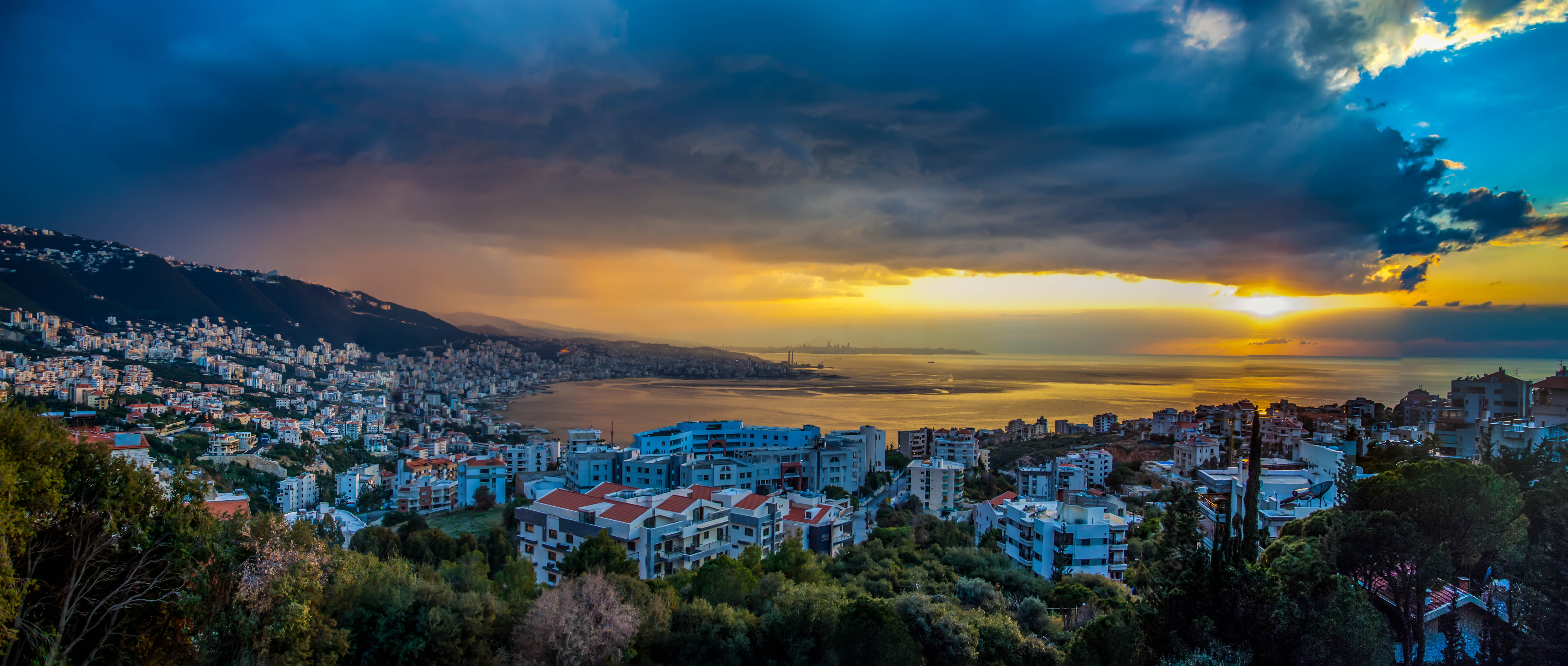 panoramic photography of buildings near sea during sunrise Jounieh 2k 4k 5k