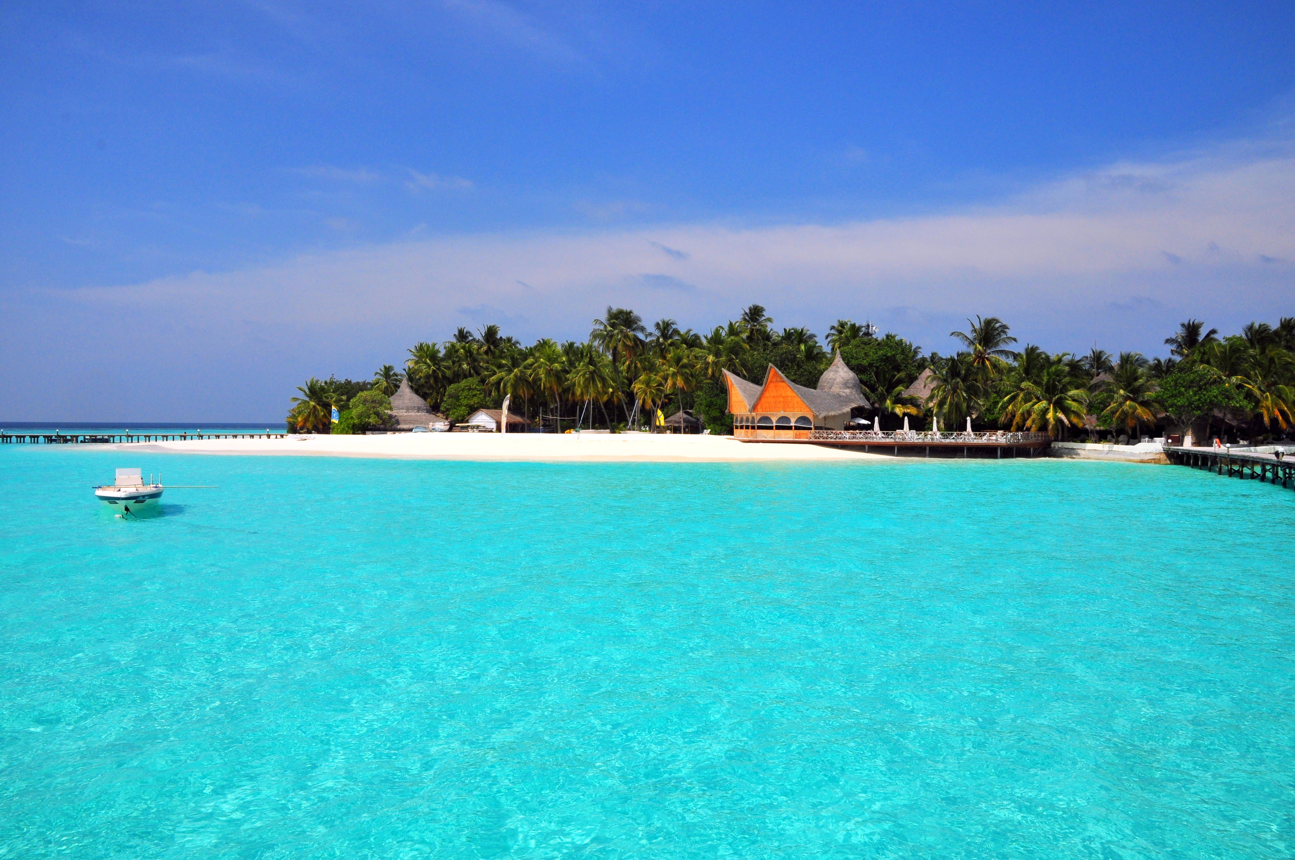 seashore and canoe boats maldives tropical beach island vacations 2k 4k