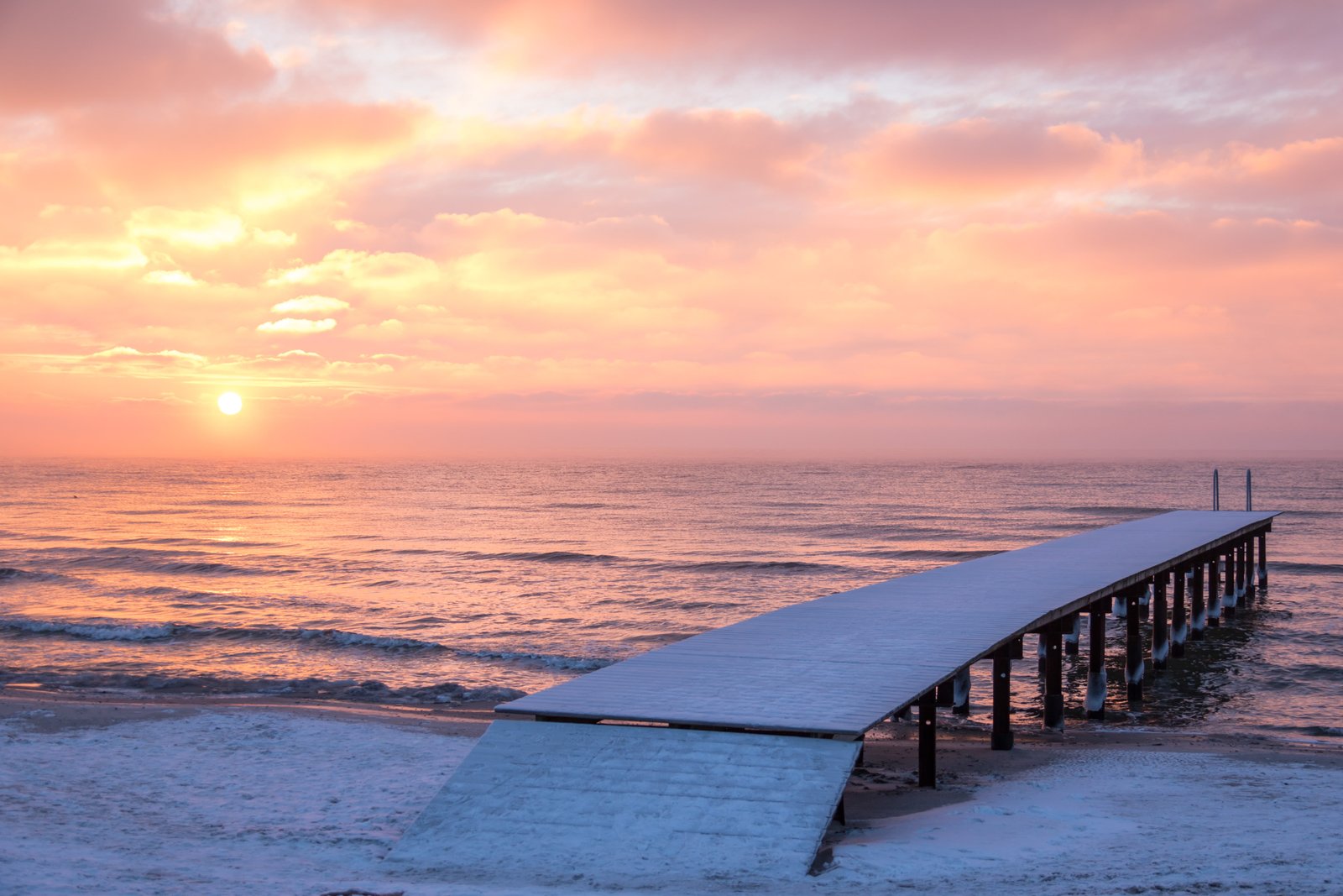 white wooden dock beside the beach during sunset Winter Sunrise 2k 4k 5k