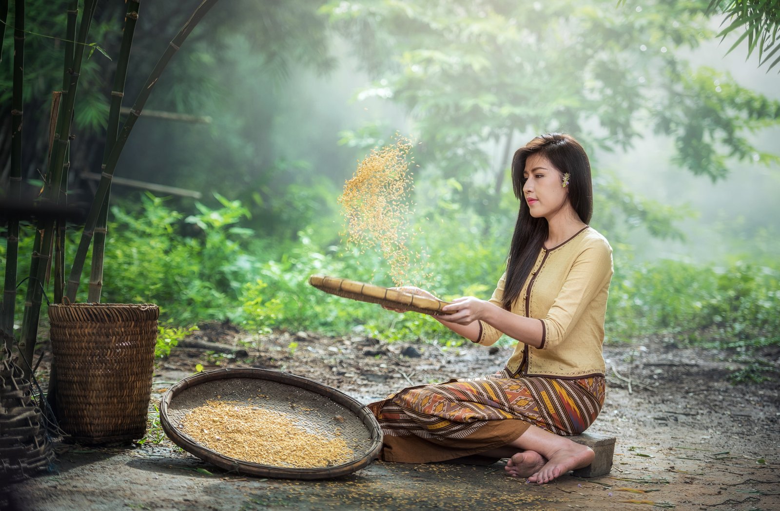 woman wearing white long sleeved shirt and brown yellow skirt holding wicker basket 2k 4k 5k
