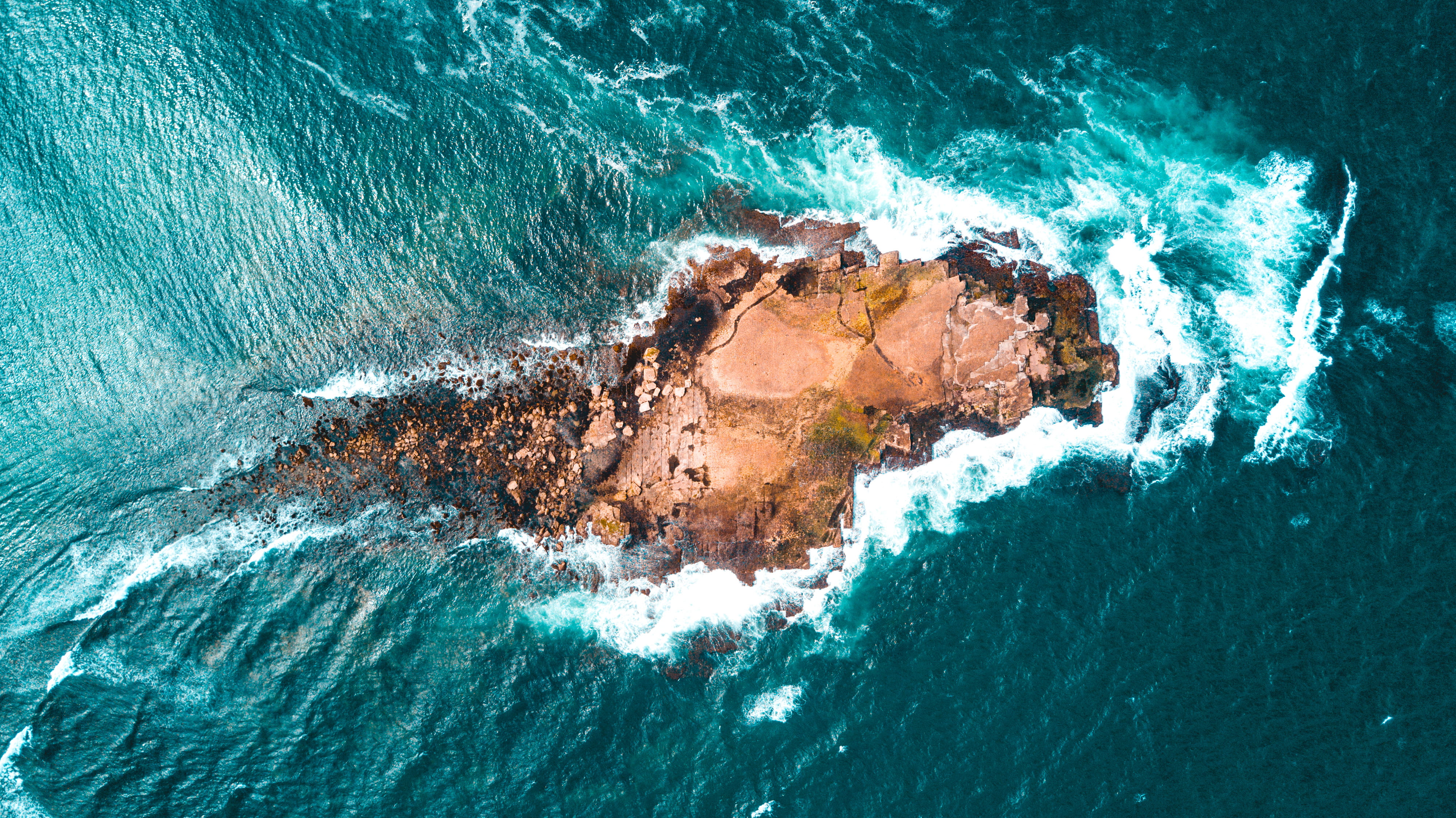 top view of rocky small island aerial sea ocean 2k 4k