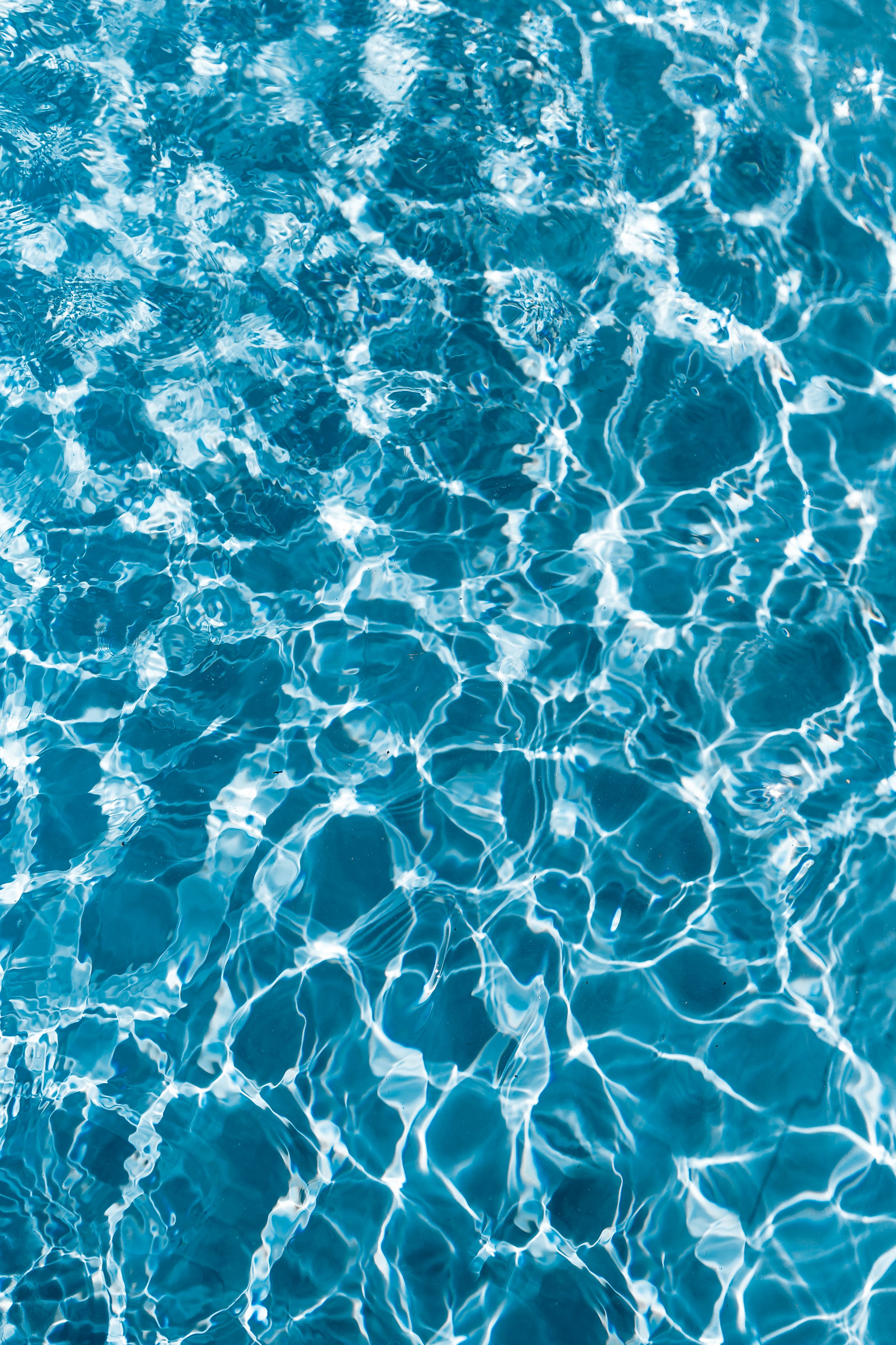 Wavy water surface in a swimming pool wave abstract background 2k 4k