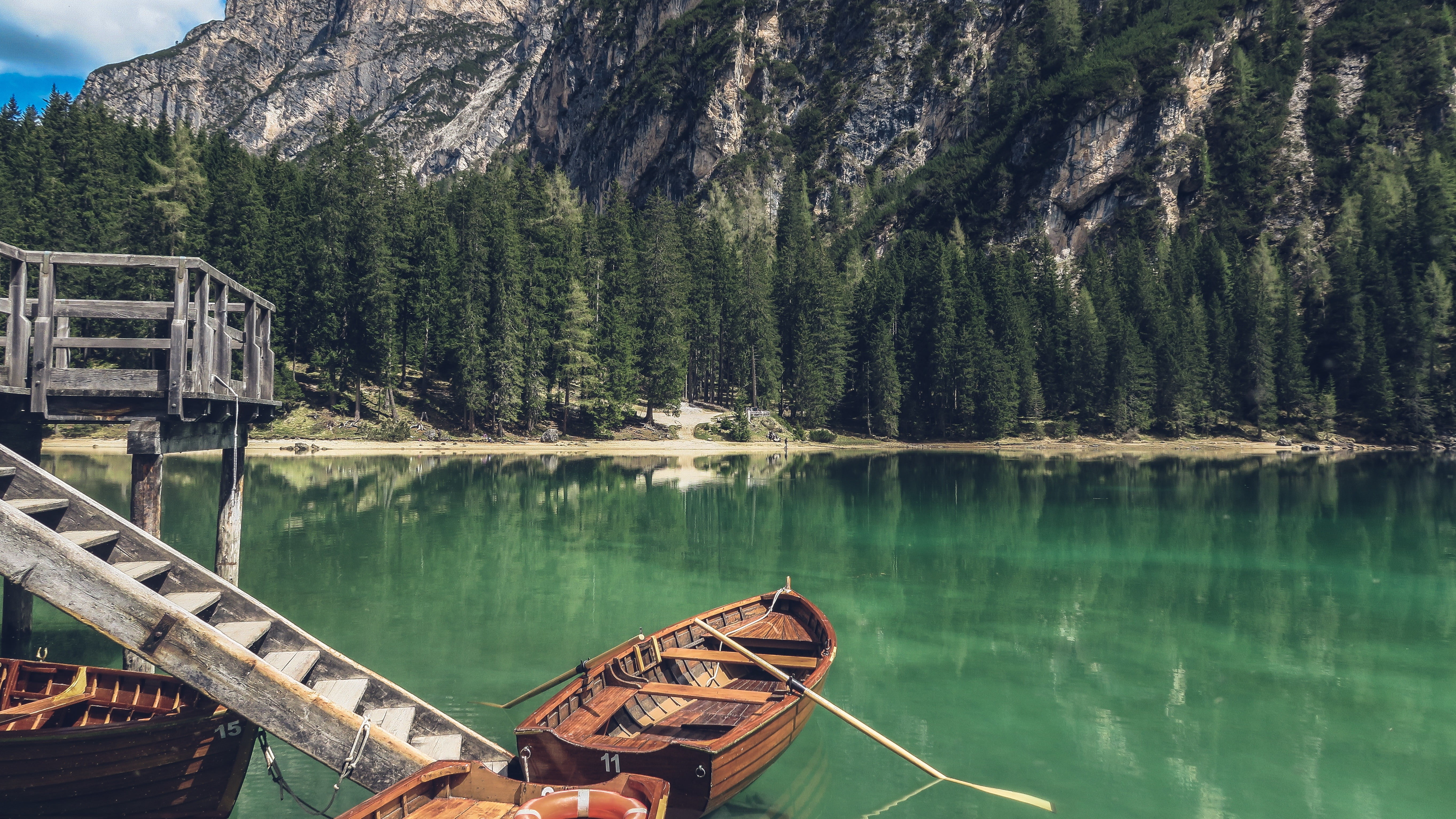 brown boat on body of water nature trees mountains beauty in 2k 4k 5k
