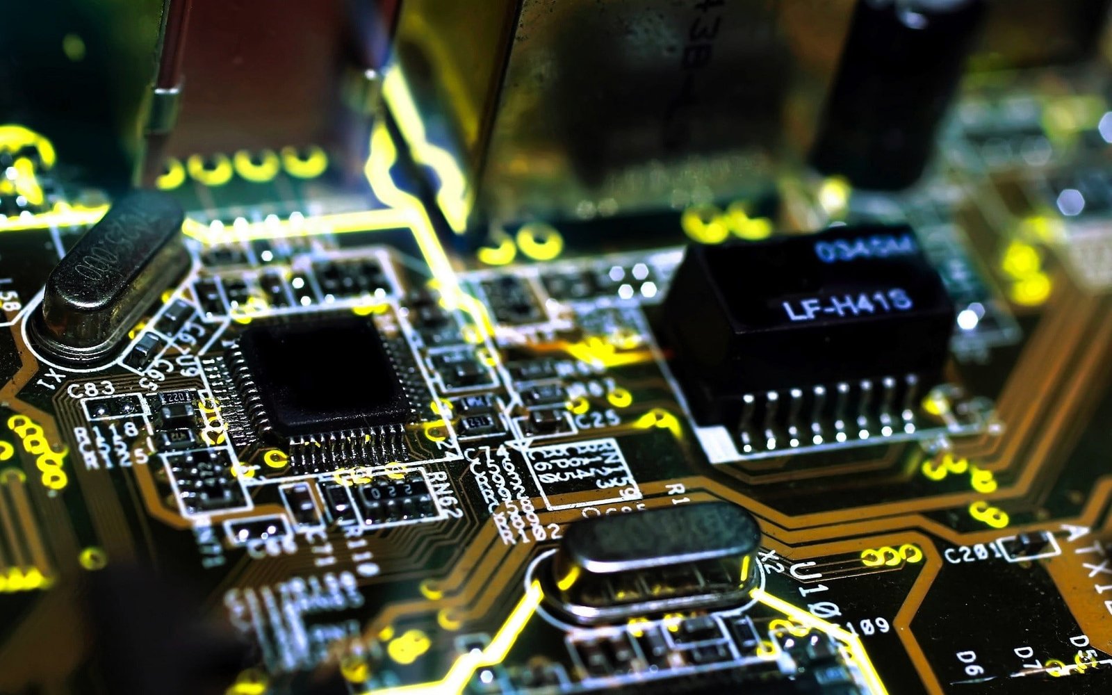 black circuit board shallow focus of and green 2k
