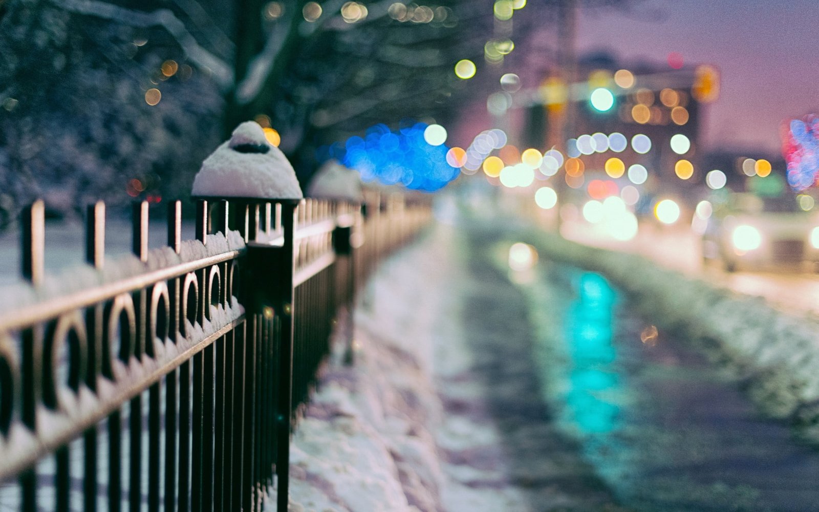 black metal rails winter macro snow trees the city lights 2k