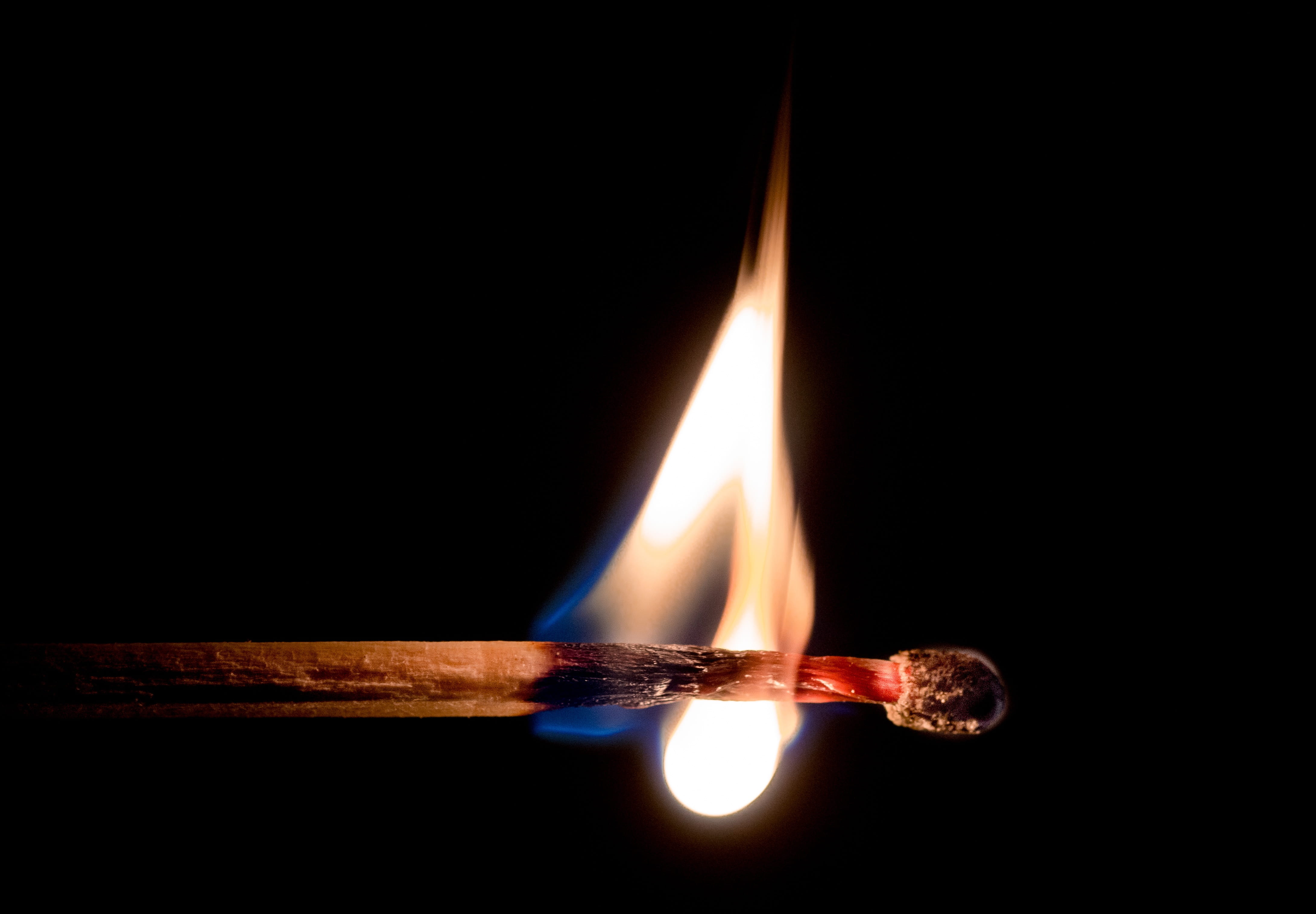 macro photography of match with fire lit flame glow 2k 4k