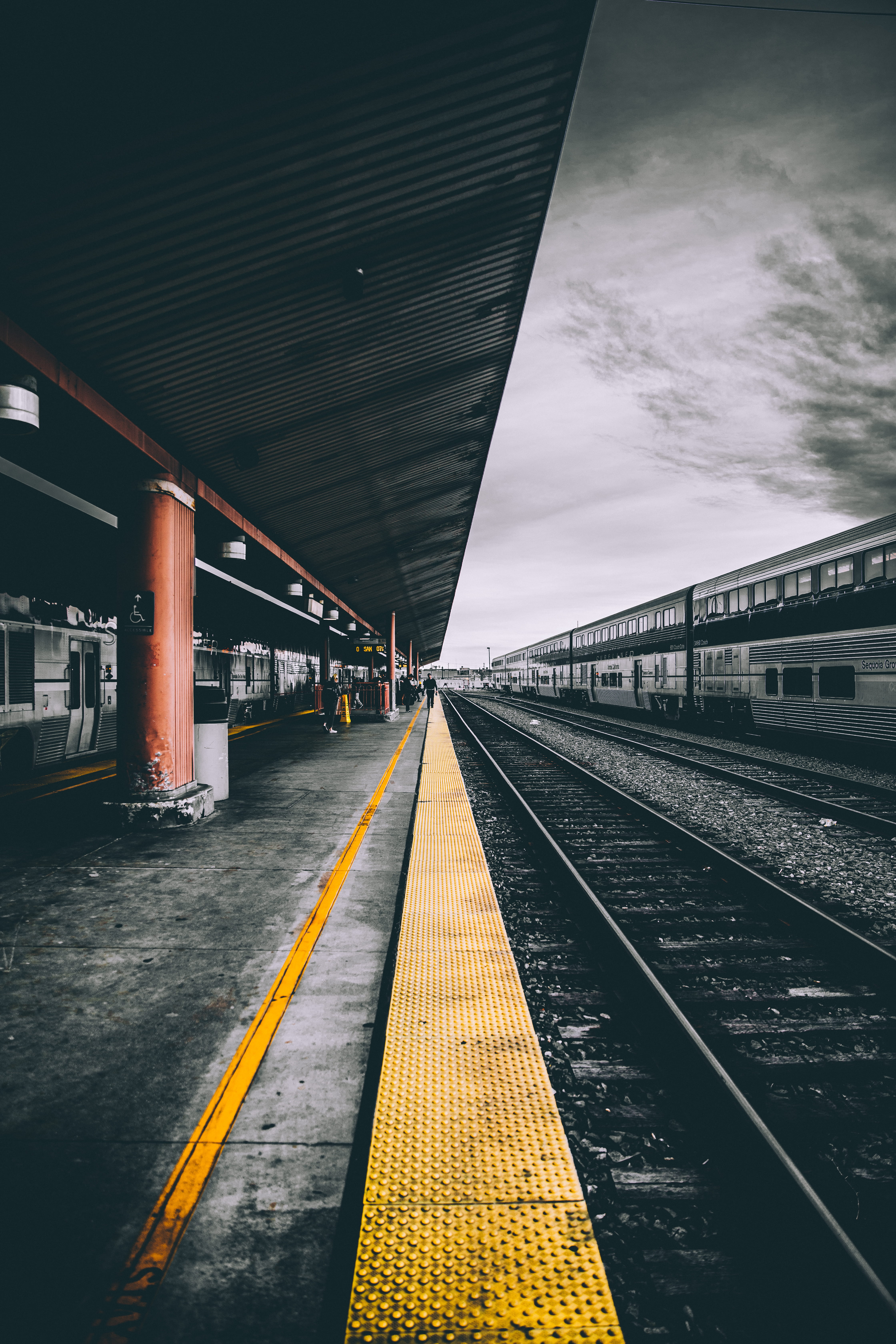 selective color photography of train railways macro station under the cloudy sky 2k 4k