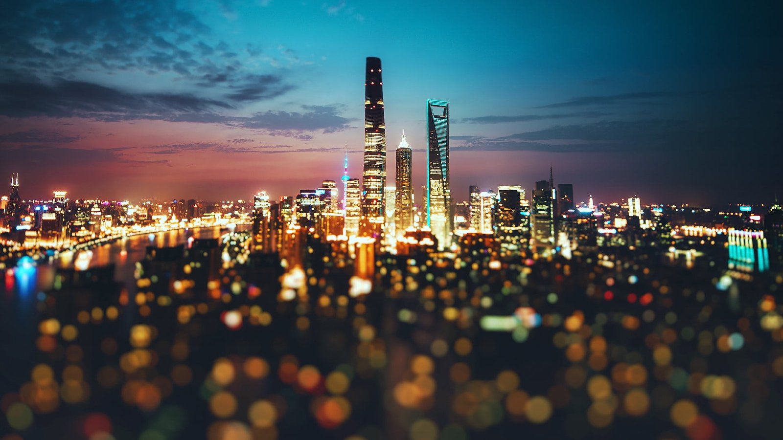 architectural photography of building lighted high rise buildings at night time 2k