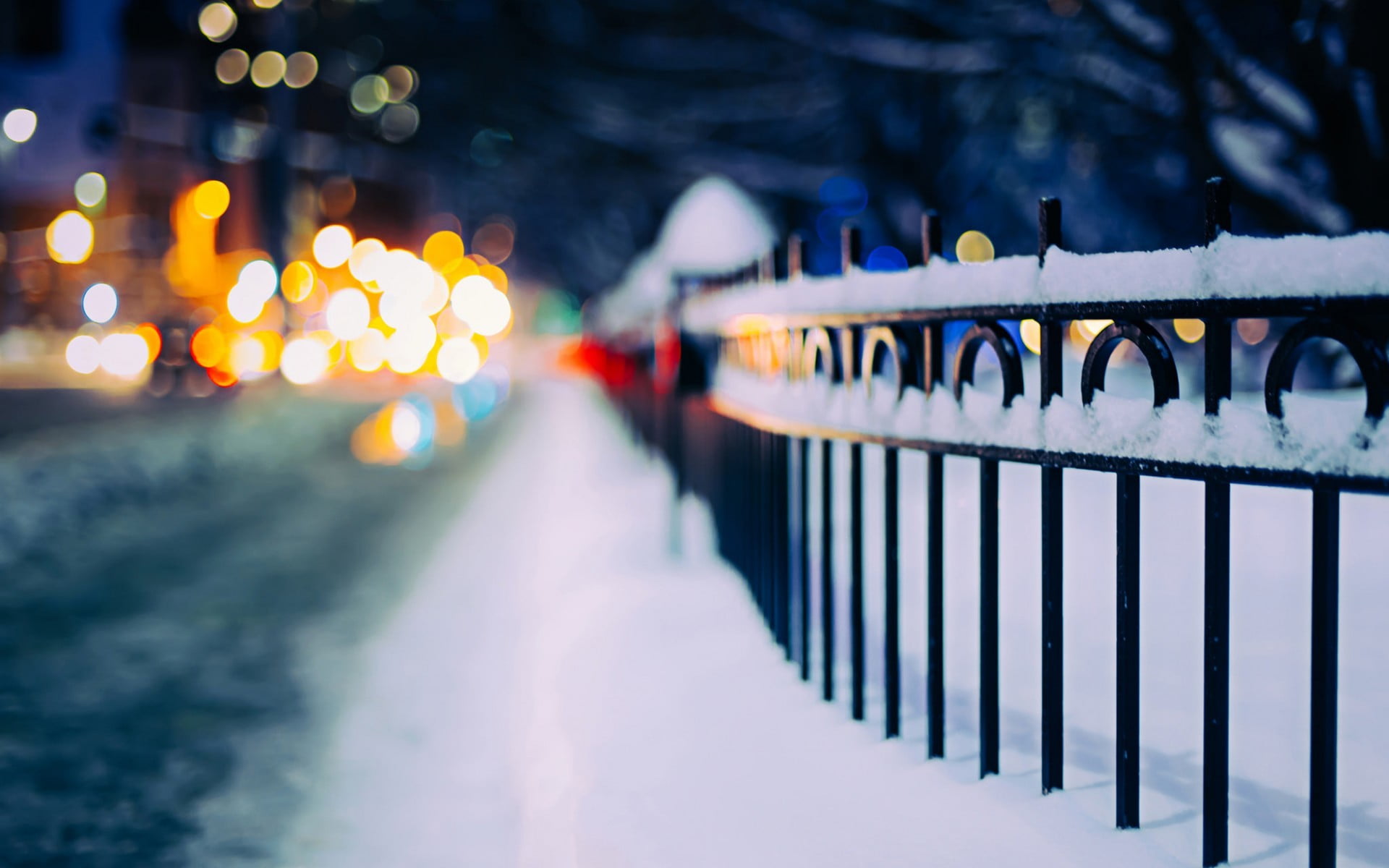 black metal fence steel railing with snow in shallow photography 2k