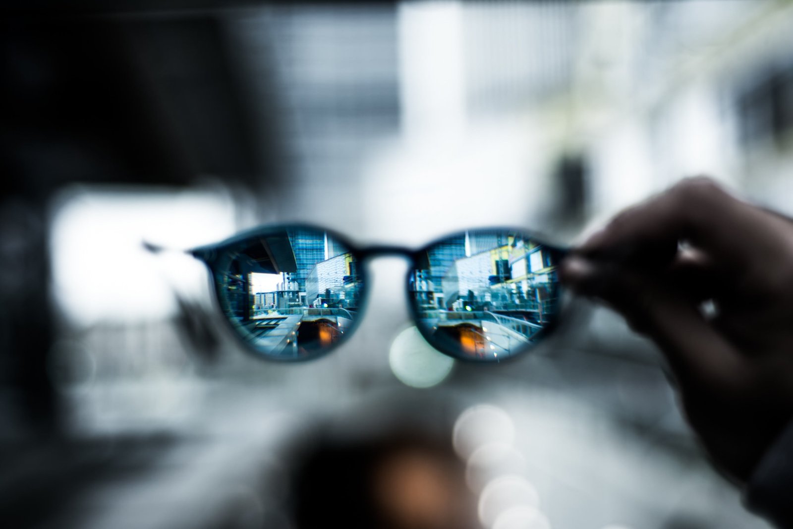 black sunglasses city depth of field bokeh blurred urban 2k