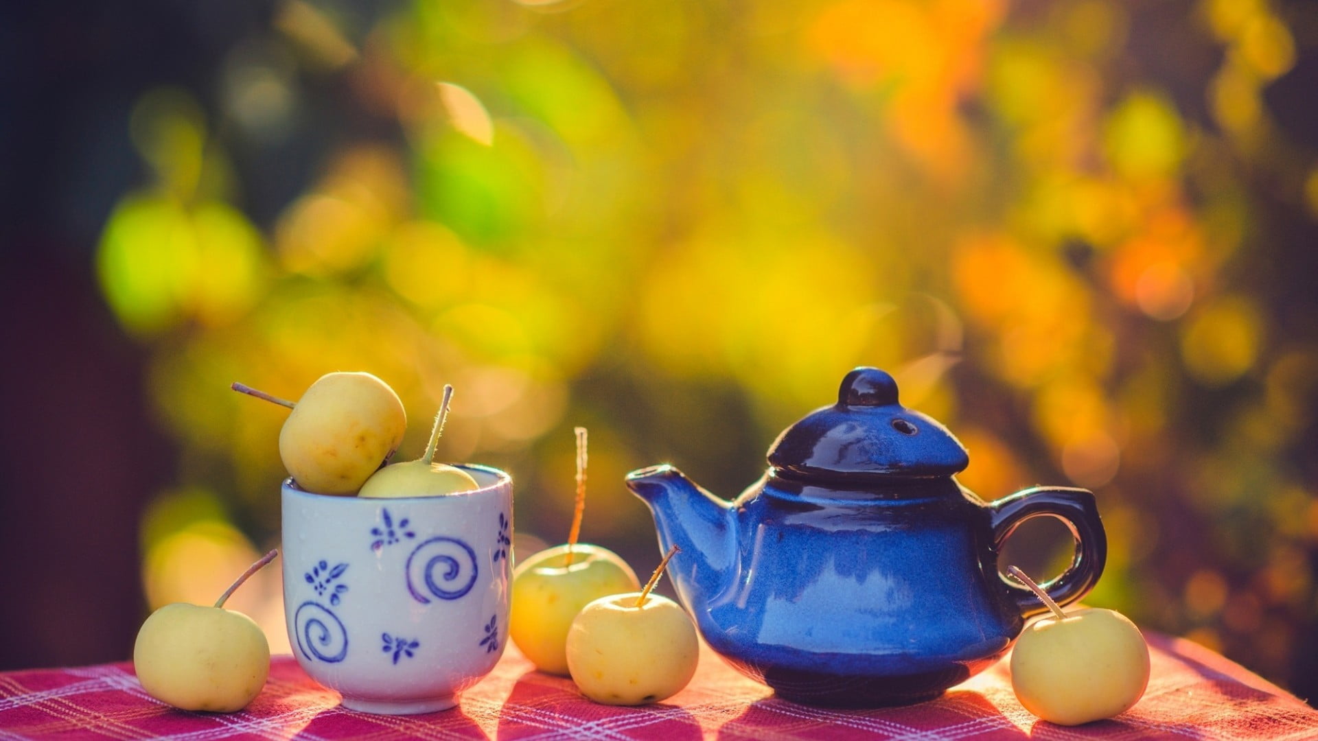 blue ceramic teapot and white mug fruit bokeh 2k