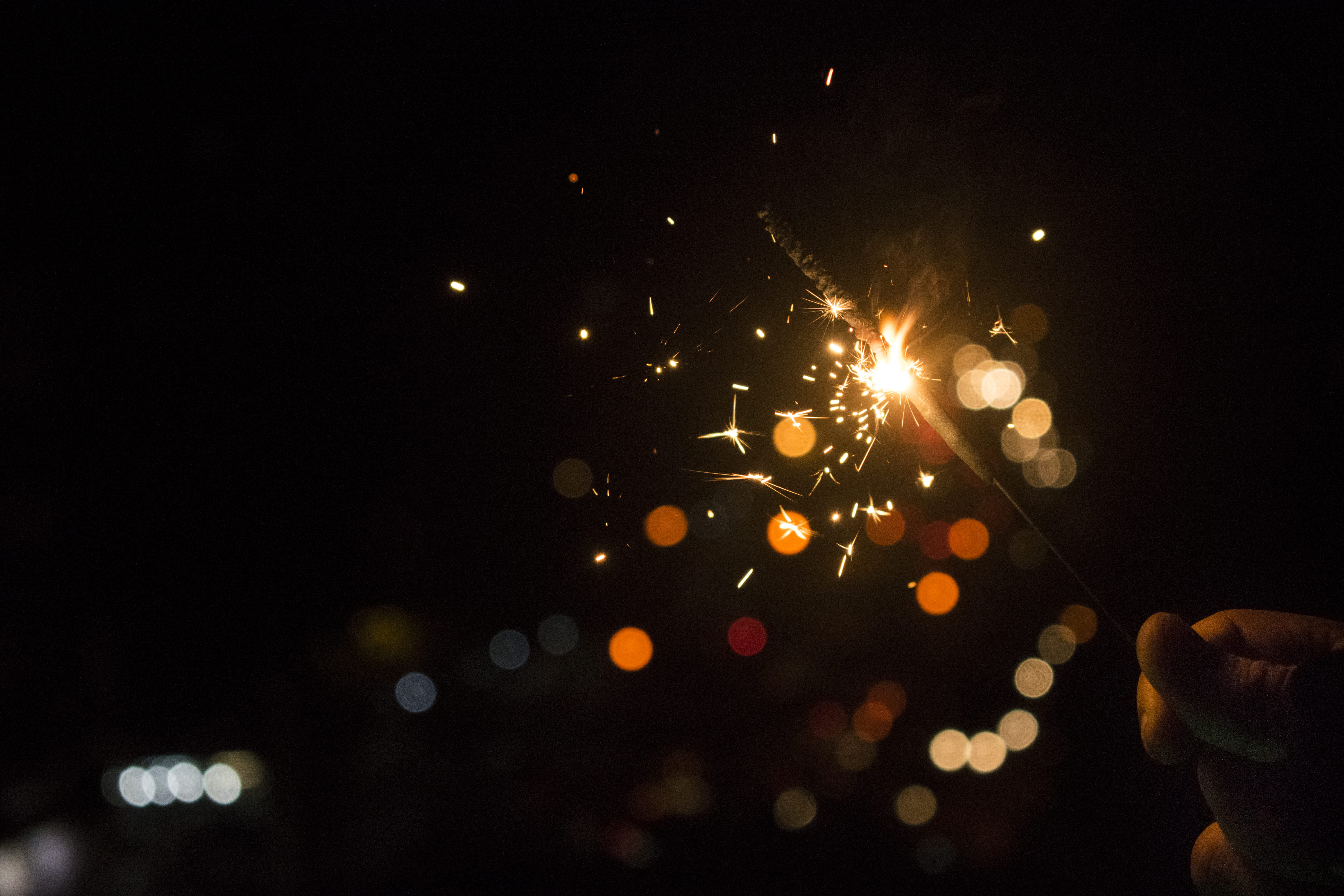 bokeh light photo photography of sparkler hand holding 2k 4k 5k