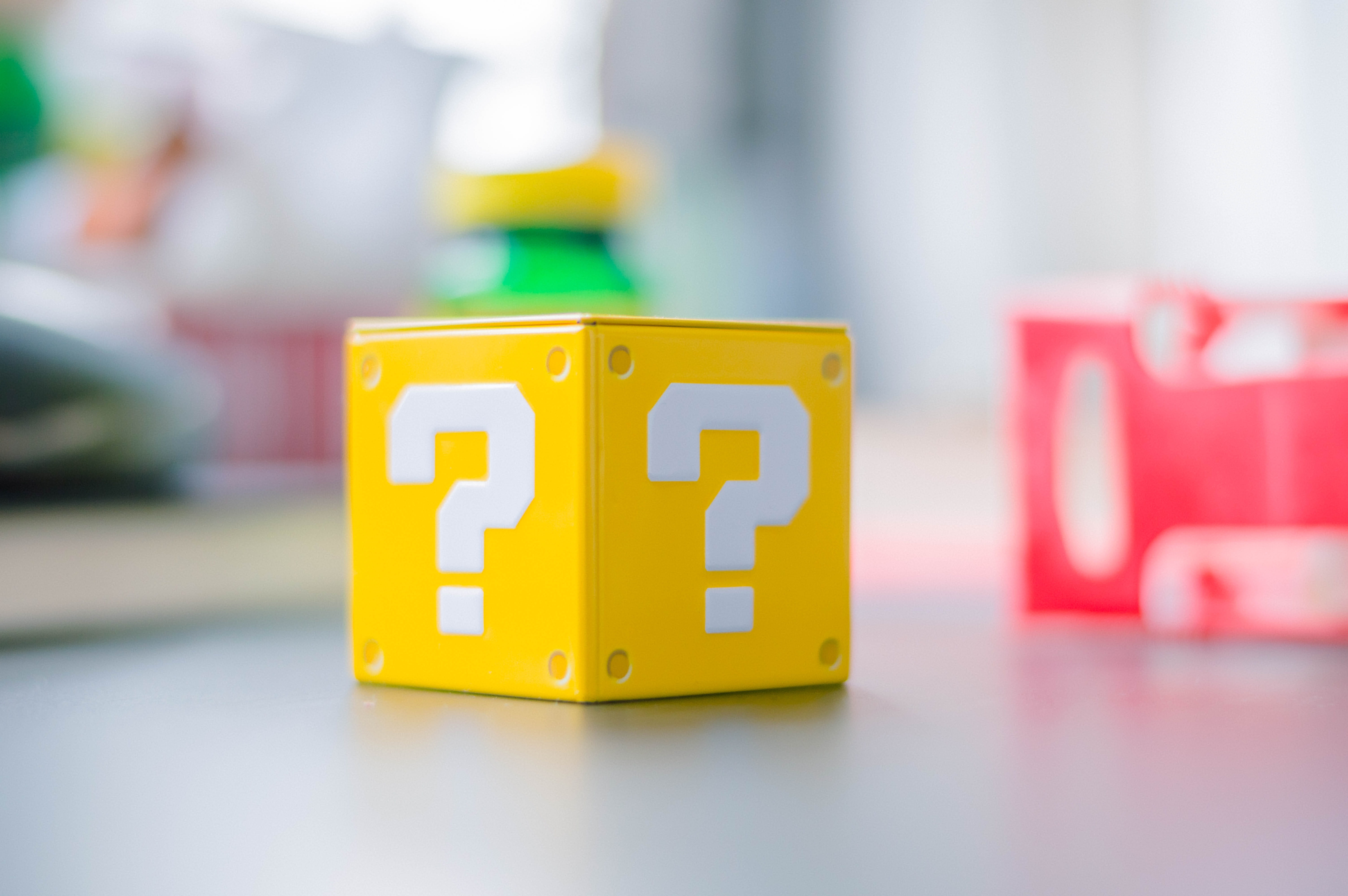 A blurred image of a yellow question mark box from Mario wallpaper 2k 4k 5k