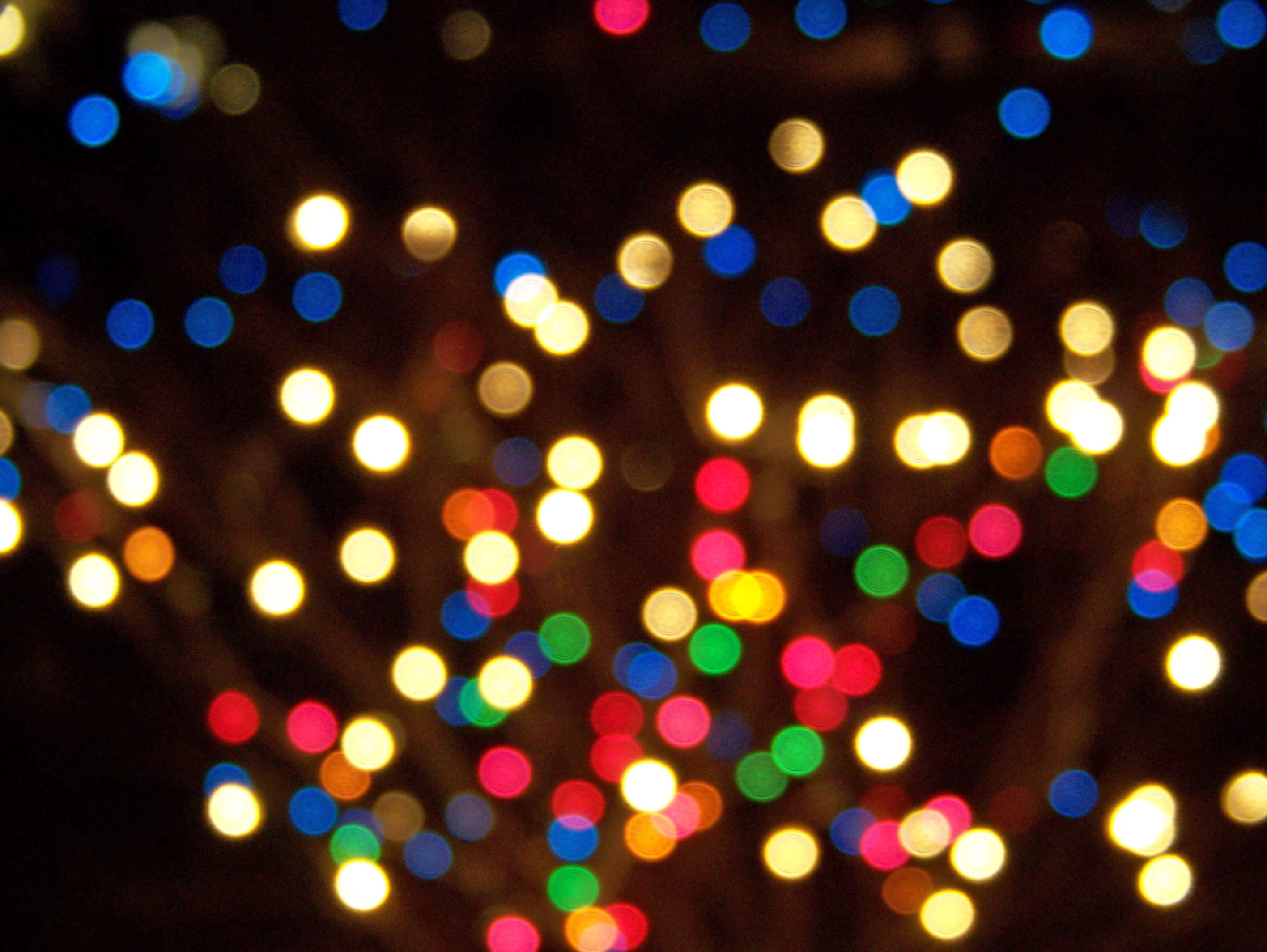 multicolored bokeh lights yellow green red christmas 2k