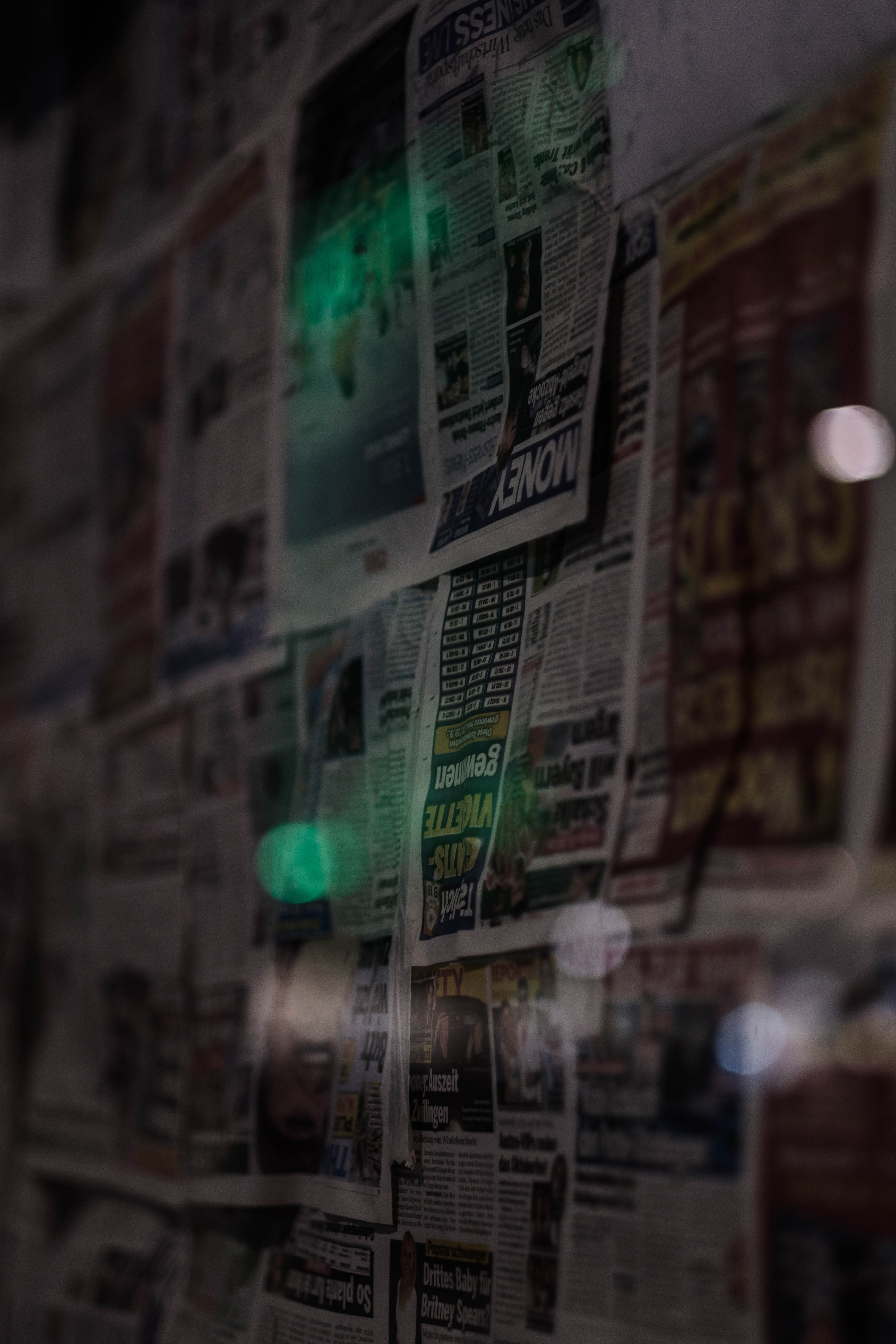 news paper article newspaper sheets on wall light moody dark 2k 4k