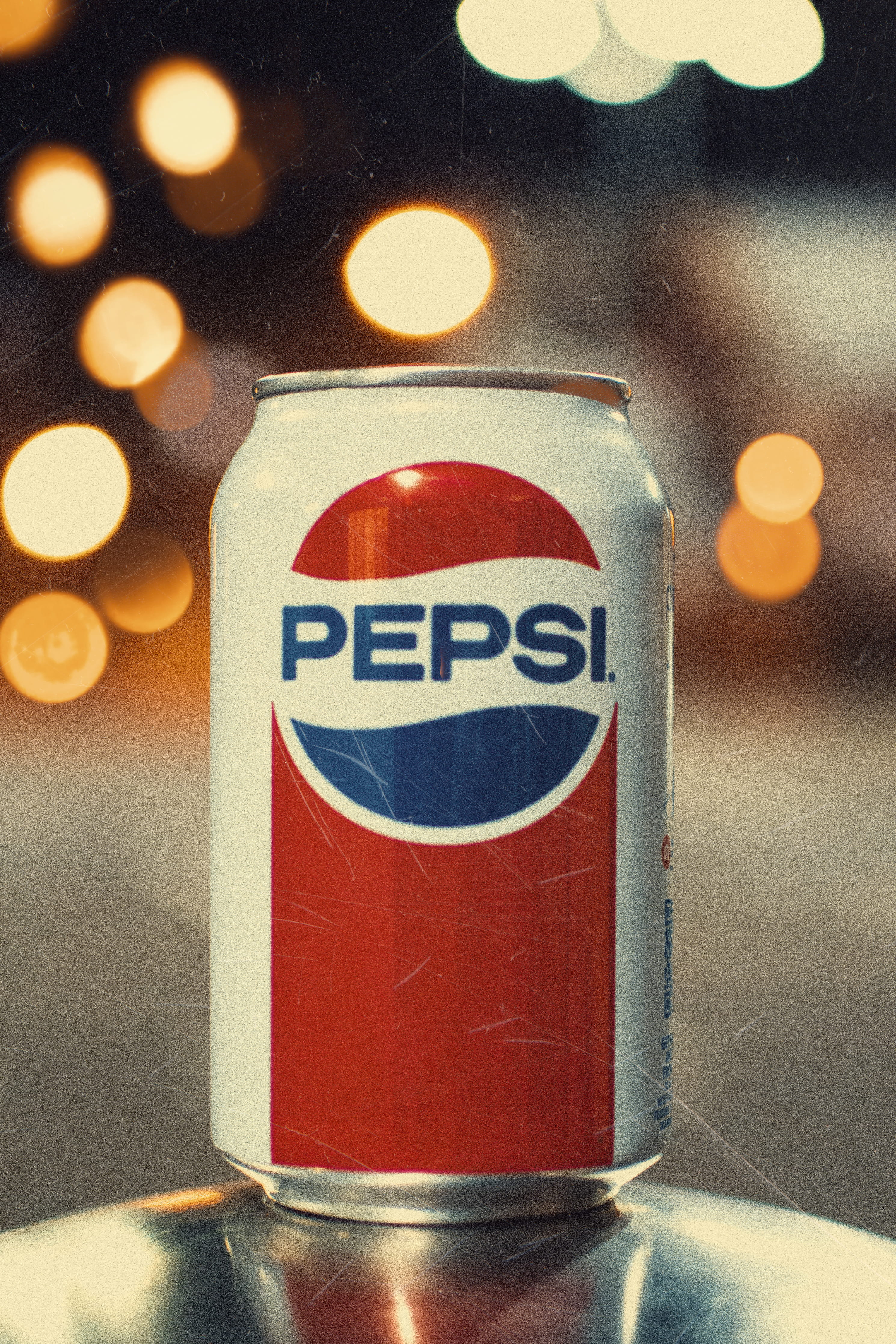 Pepsi can on gray surface light vintage bokeh brand depth of field 2k