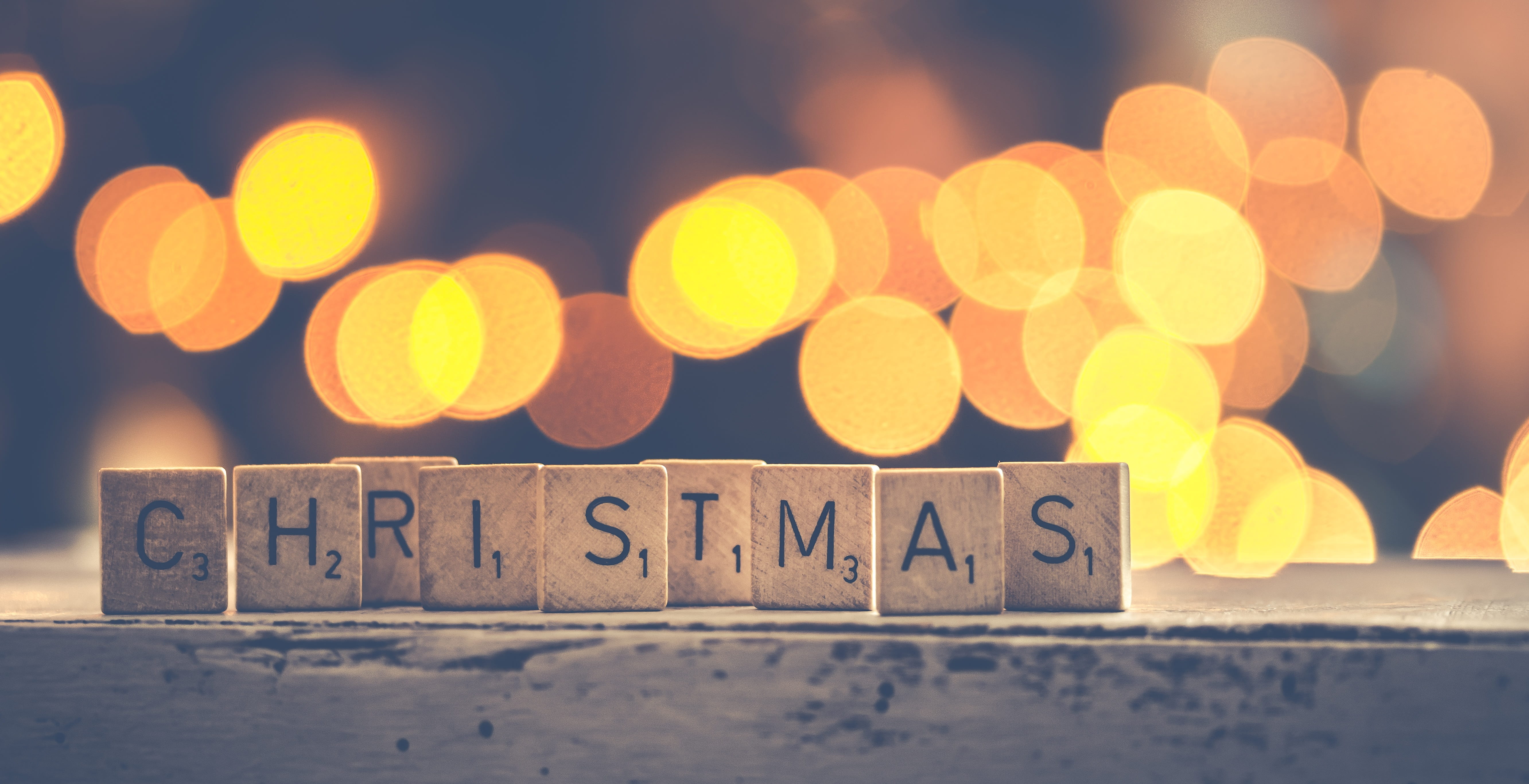 scrabble tile forming CHRISTMAS word bokeh photography background 2k 4k 5k