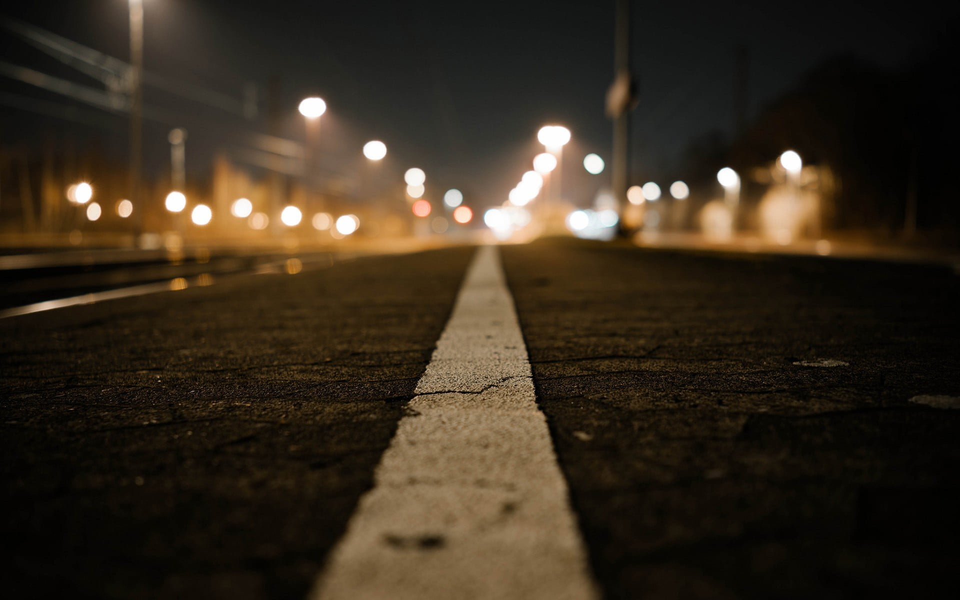 white road line concrete pavements bokeh ground street 2k