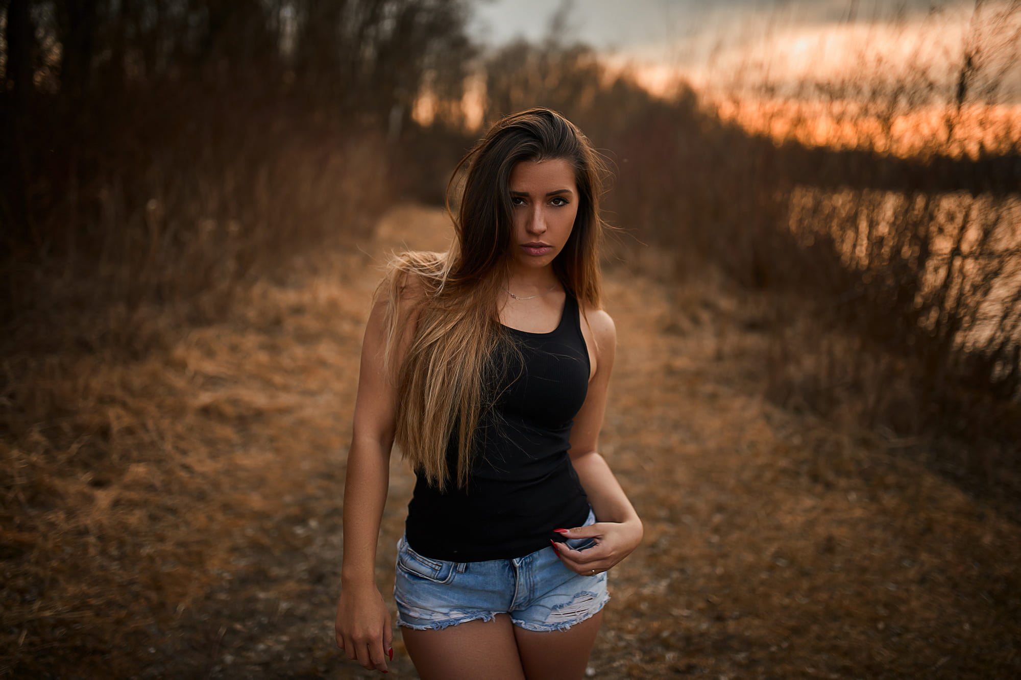 women s black tank top and blue denim shorts brunette outdoors 2k
