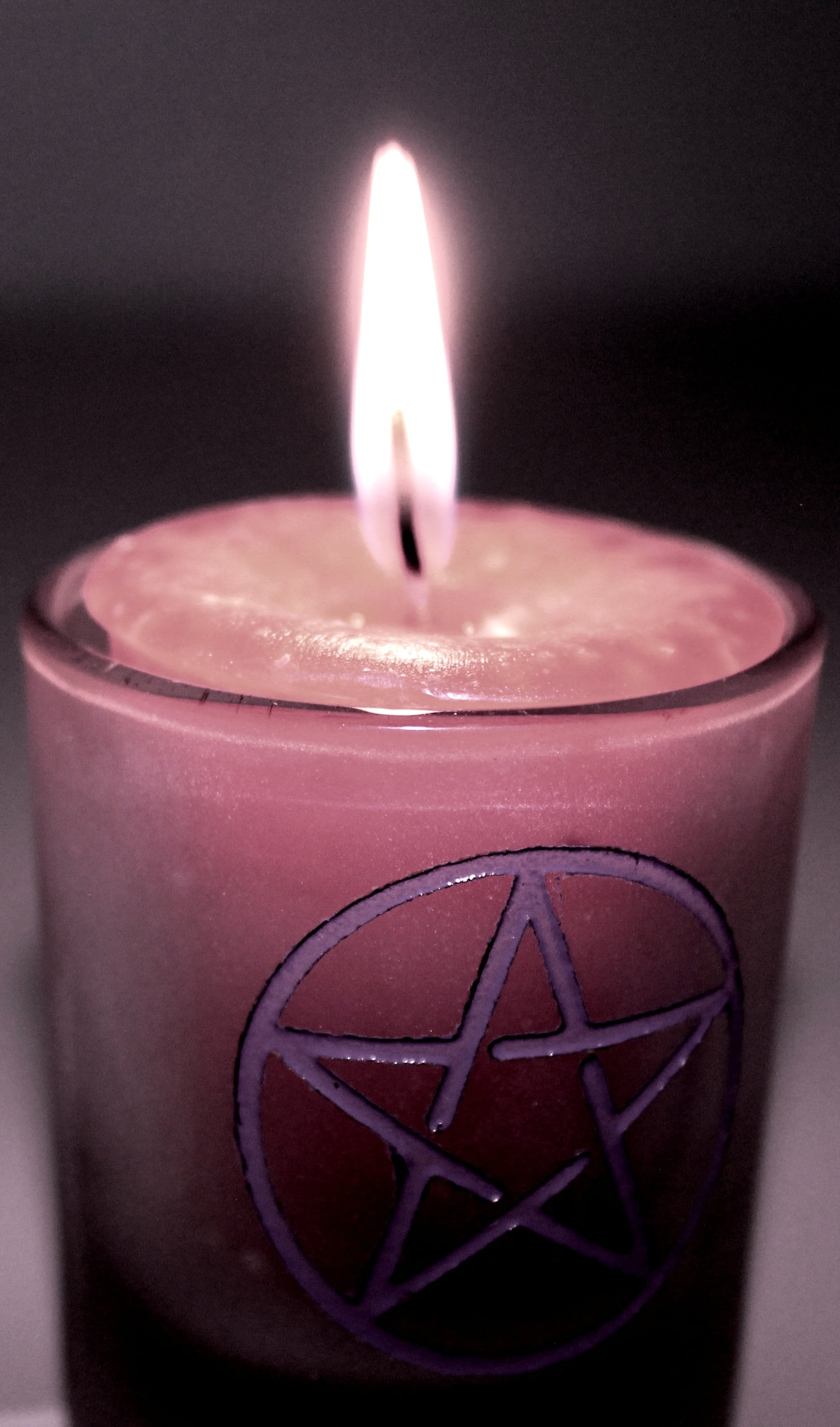 closeup photo of lighted pink votive candle magic magick 2k