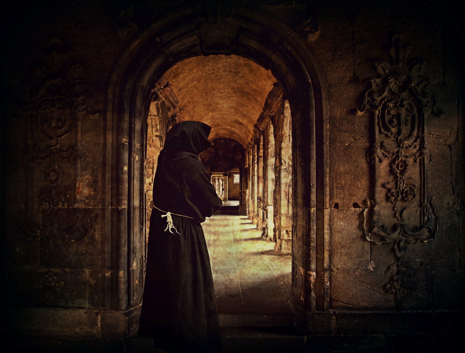 person wearing black hoodie top photo monk man monastery archway 2k
