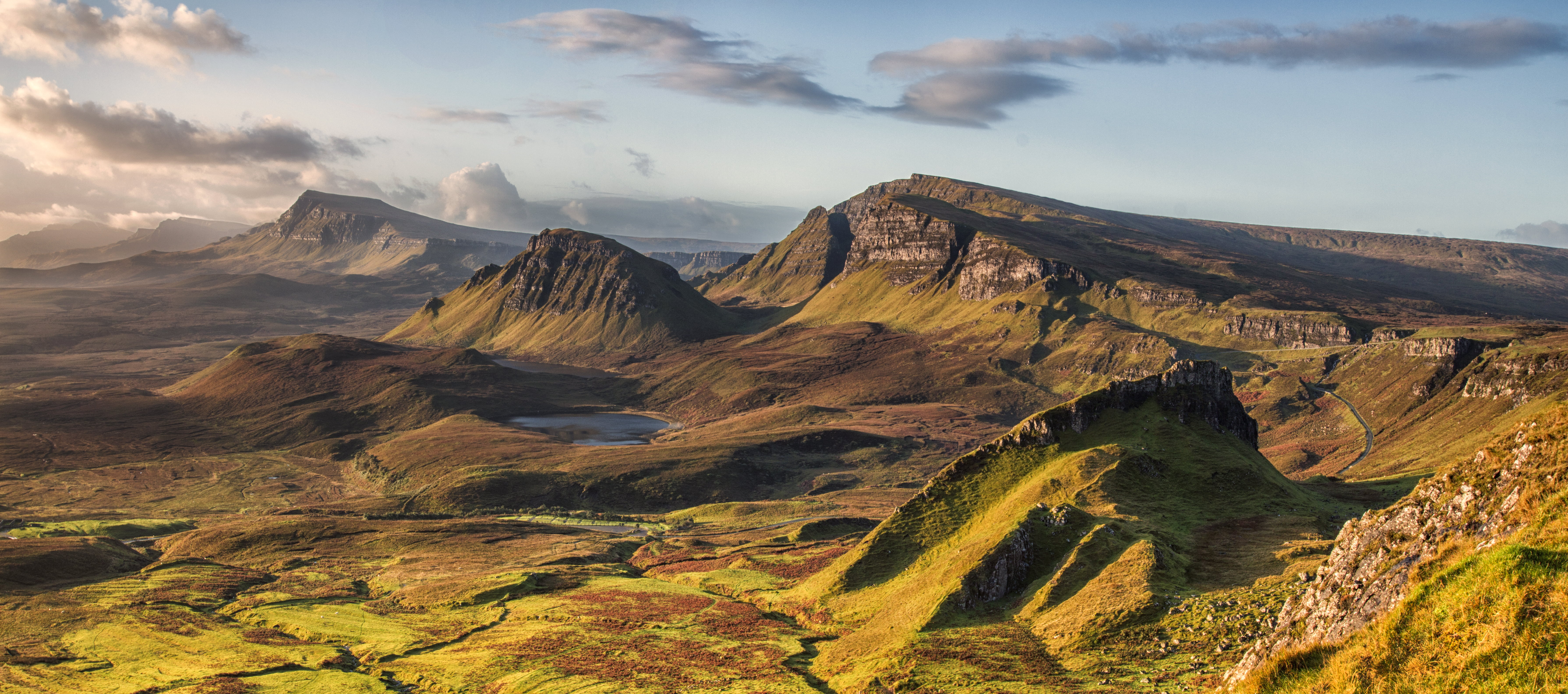 landscape photo of rocky mountains under cloudy sky quiraing skye scotland 2k 4k 5k