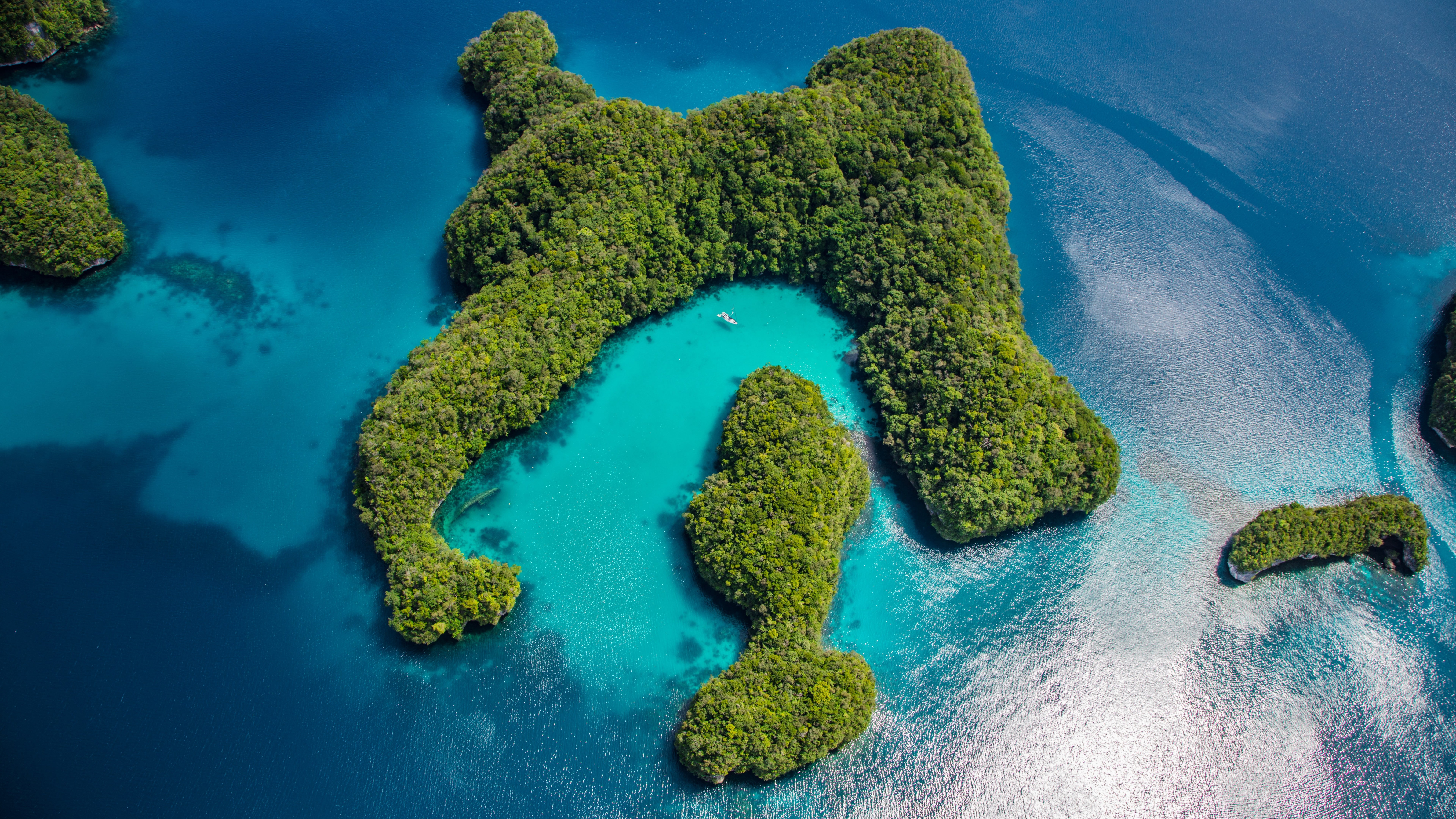 aerial photography of green island with blue sea Palau Philippines 2k 4k 5k 8k